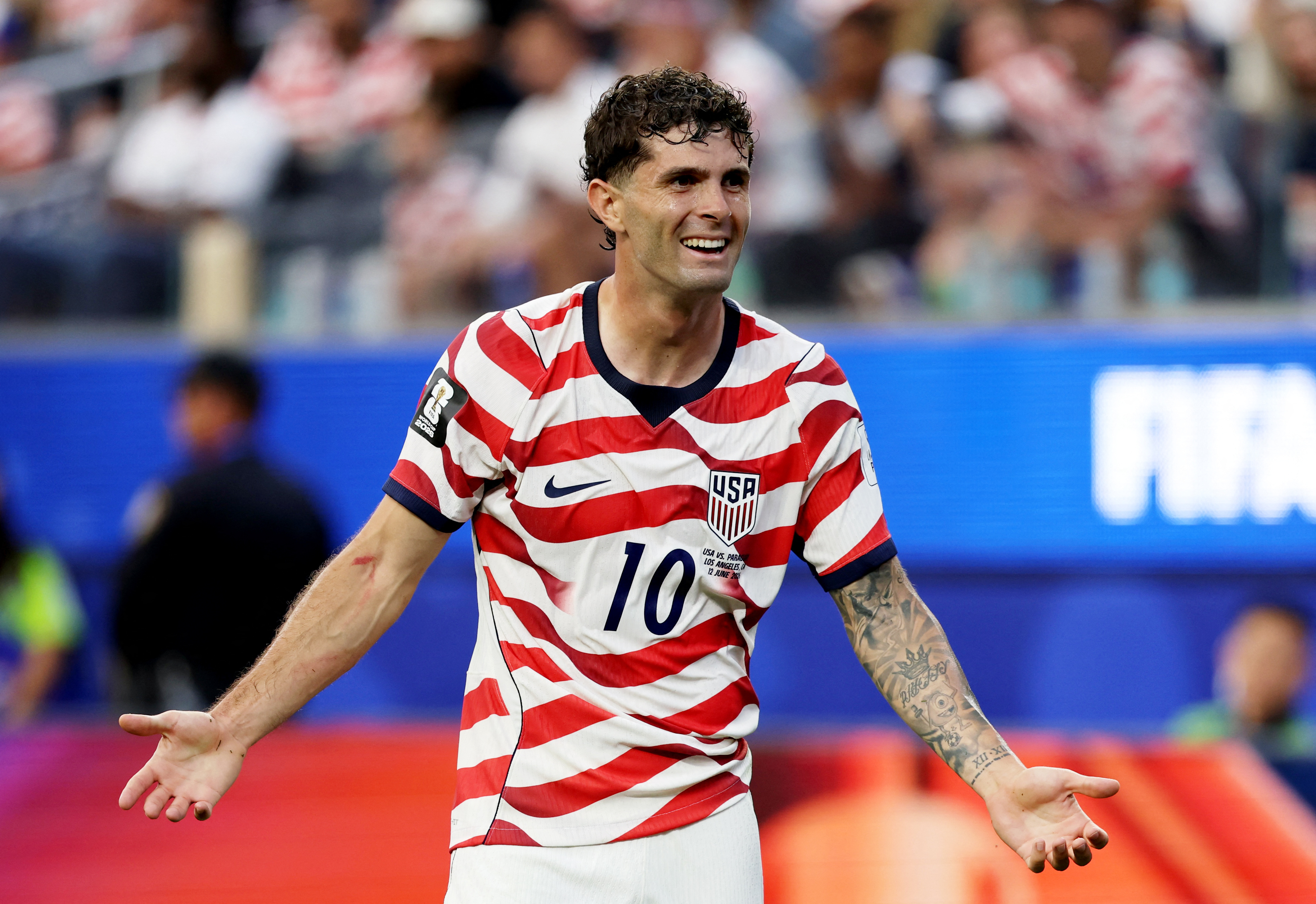 Chritain Pulisic smiles after helping the United States go ahead against Paraguay in opening Group D match.