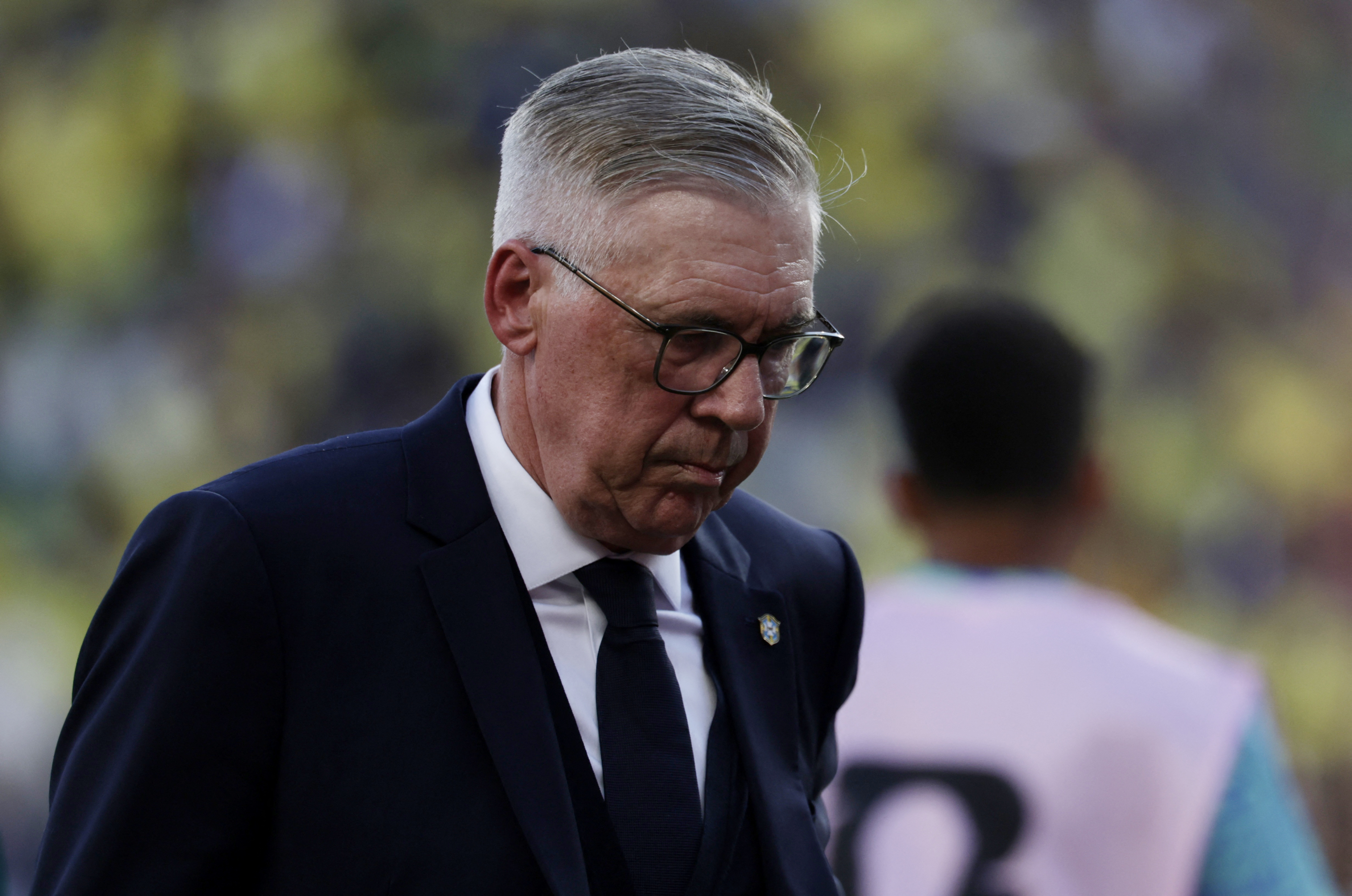 Carlo Ancelotti looks down to the ground