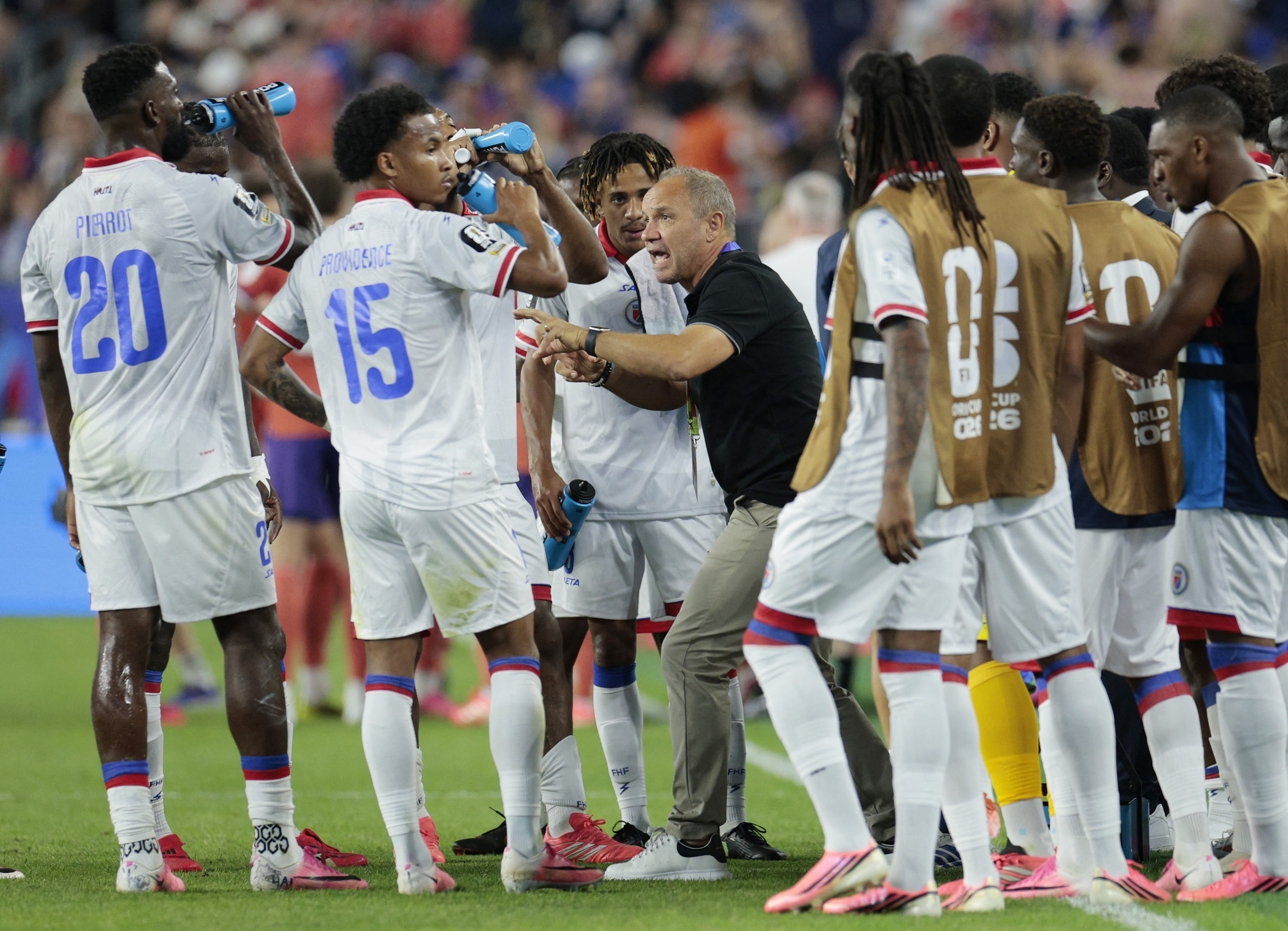 Soccer Football - FIFA World Cup 2026 - Group C - Haiti v Scotland - Boston Stadium, Foxborough, Massachusetts, U.S. - June 13, 2026 Haiti coach Sebastien Migne gives instructions to his players during a hydration break REUTERS/Brian Snyder