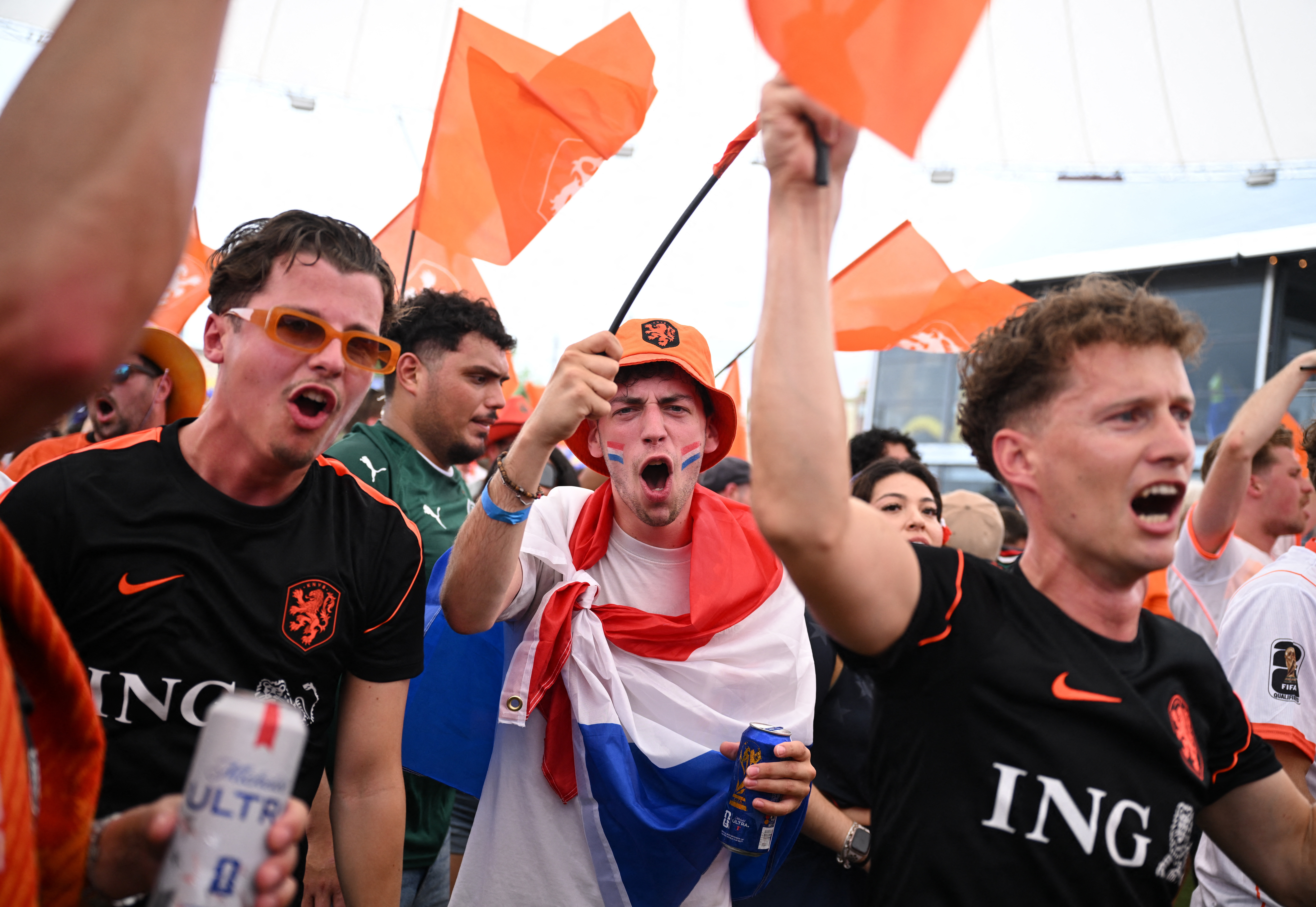 People holding flags and celebrating.