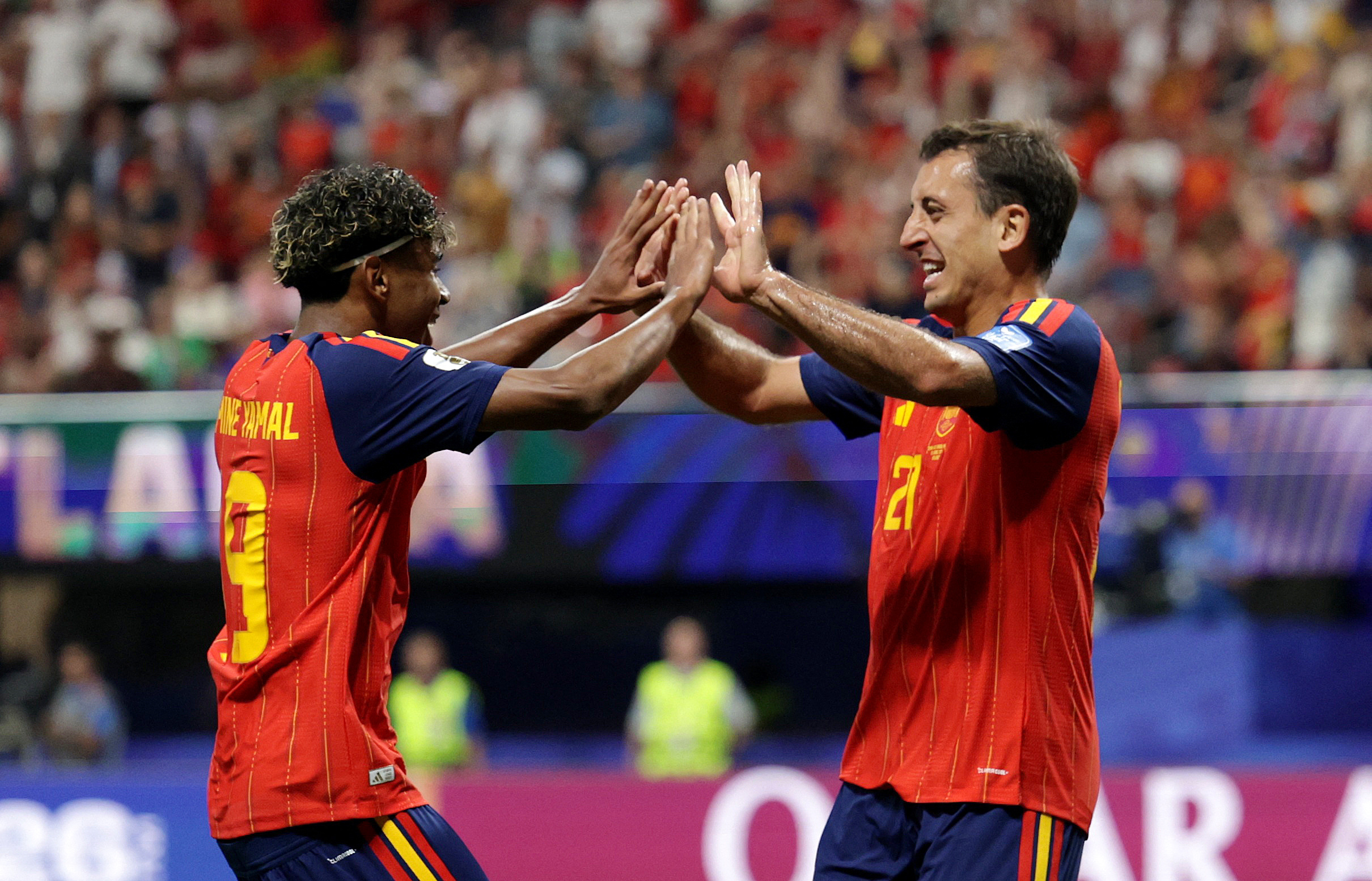 Lamine Yamal and Mikel Oyarzabal high five