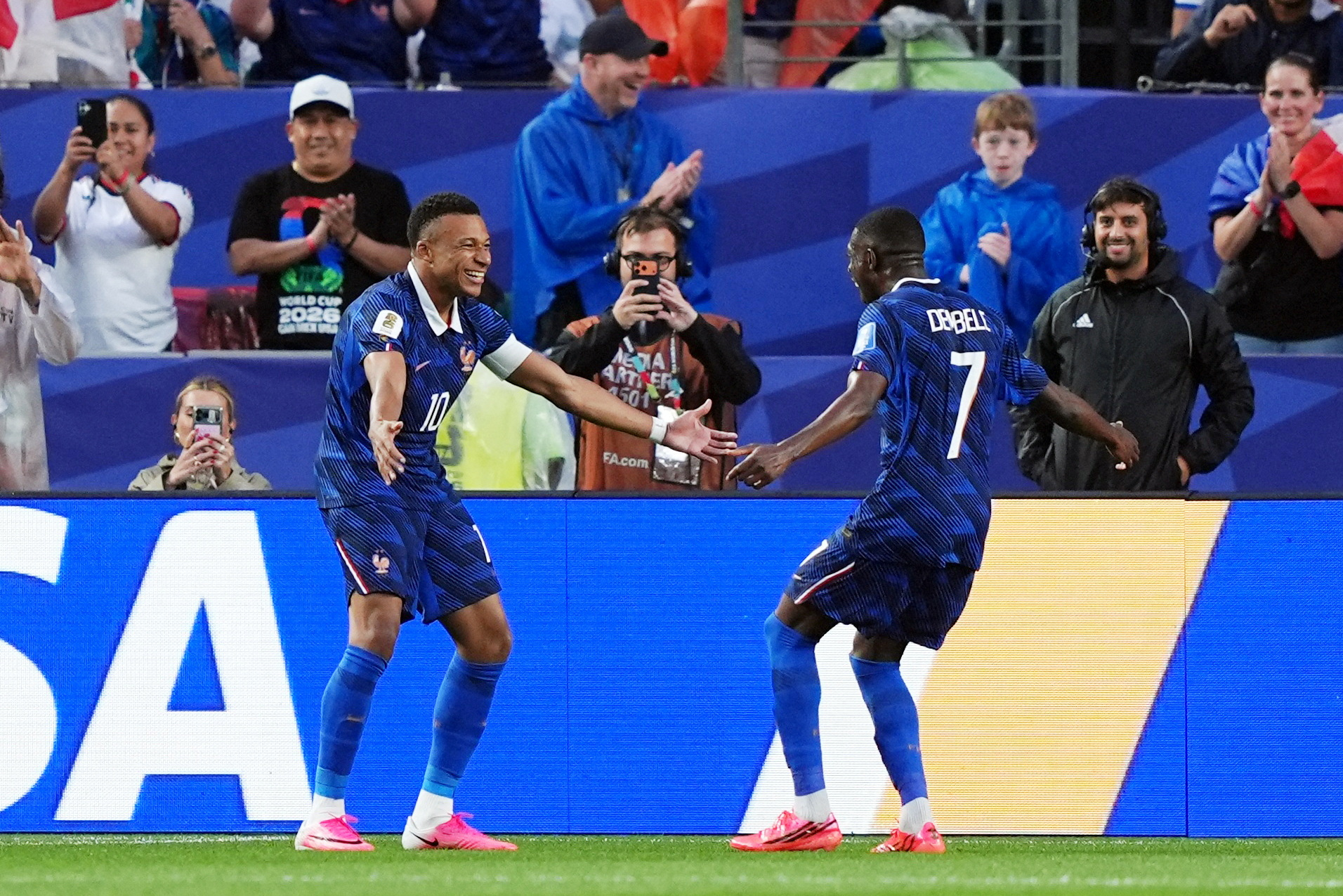 France's Kylian Mbappe celebrates scoring their second goal with Ousmane Dembele.