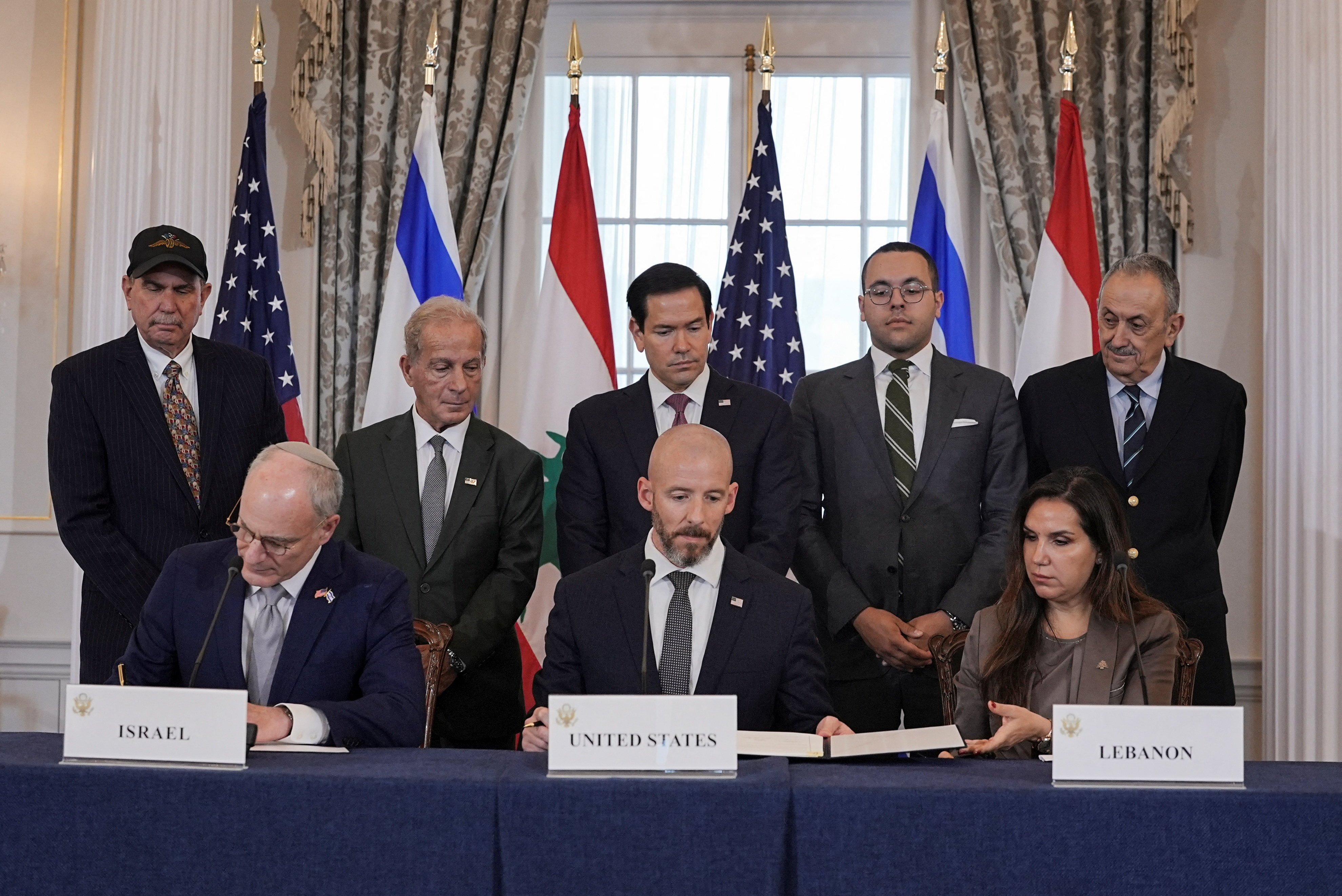 US Secretary of State Marco Rubio looks on as State Department Counselor Daniel Holler, Israel's Ambassador to the US Yechiel Leiter and Lebanon's Ambassador to the US Nada Hamadeh sign a framework agreement between Israel and Lebanon, at the State Department in Washington, DC, June 26, 2026. [Ken Cedeno/Reuters]