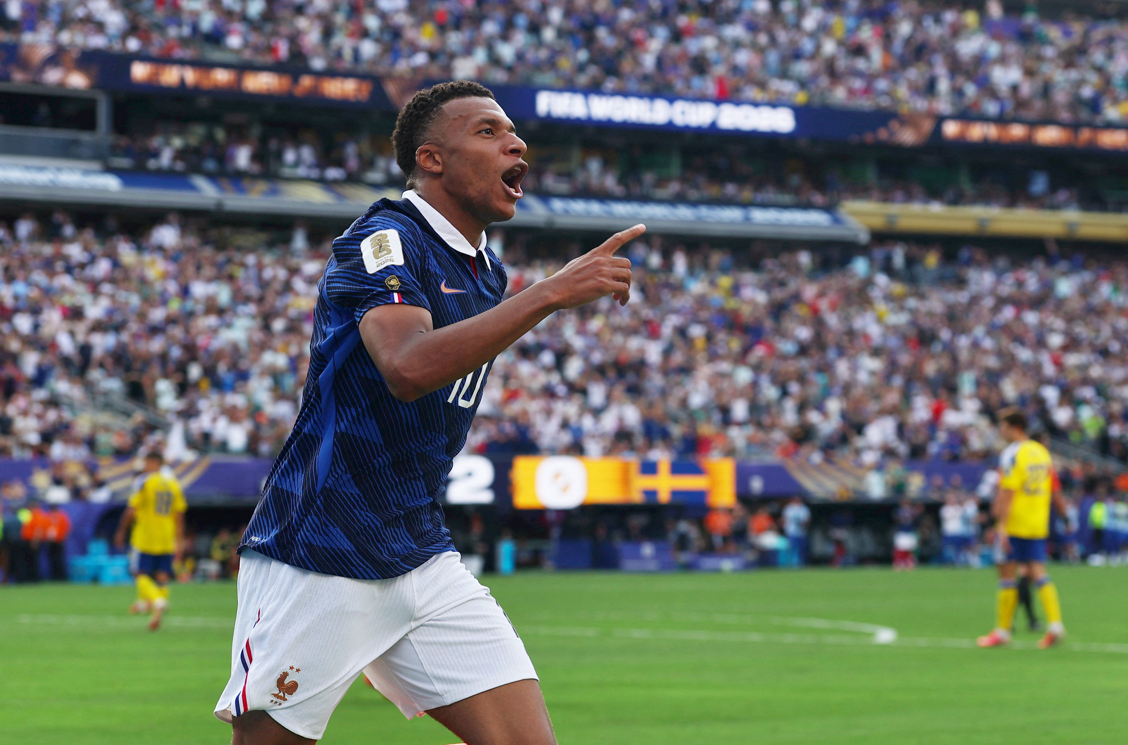 France's Kylian Mbappe celebrates scoring their third goal
