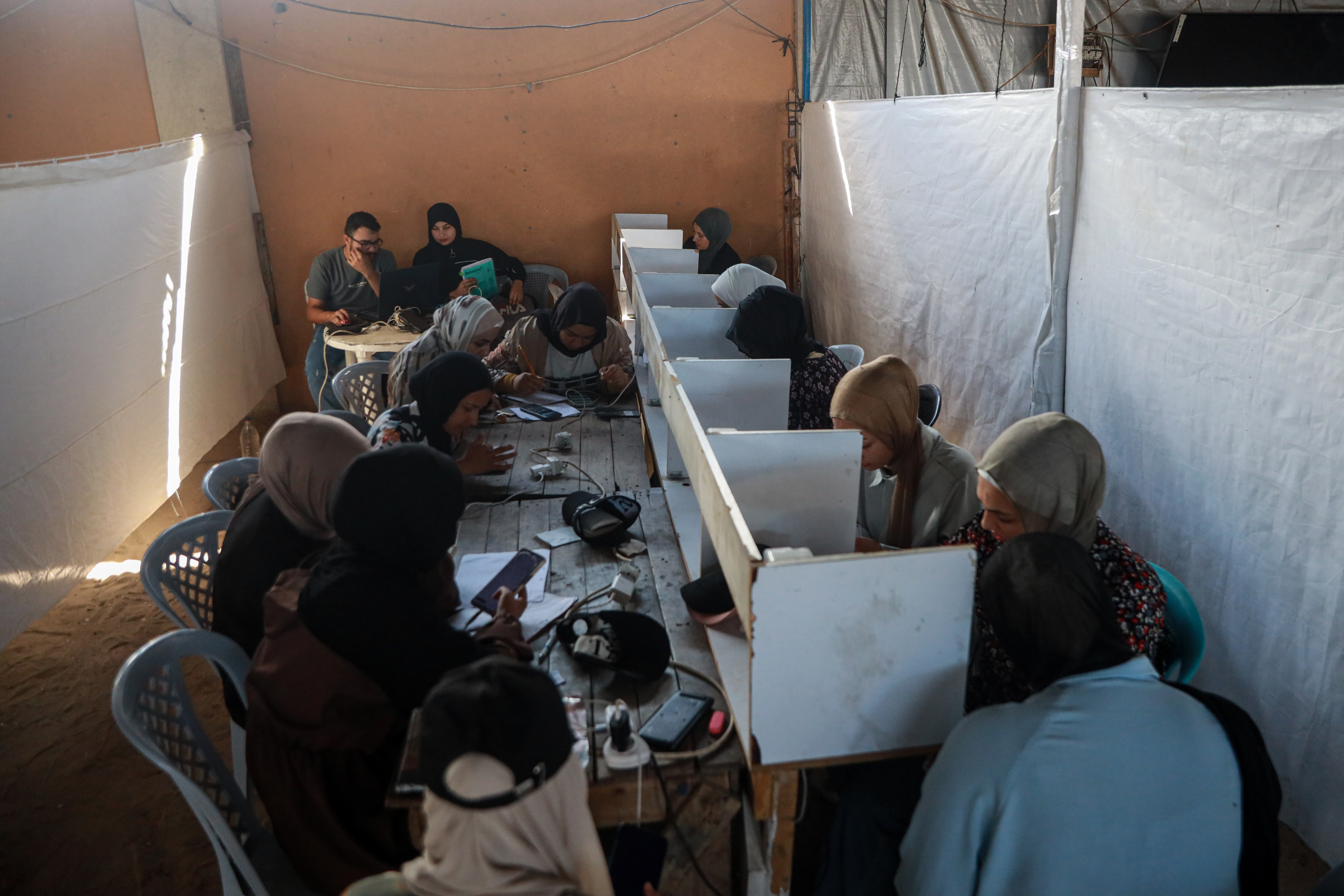 Thousands of tawjihi students are sitting for their exams online this year after the destruction of educational facilities and schools during the war on Gaza