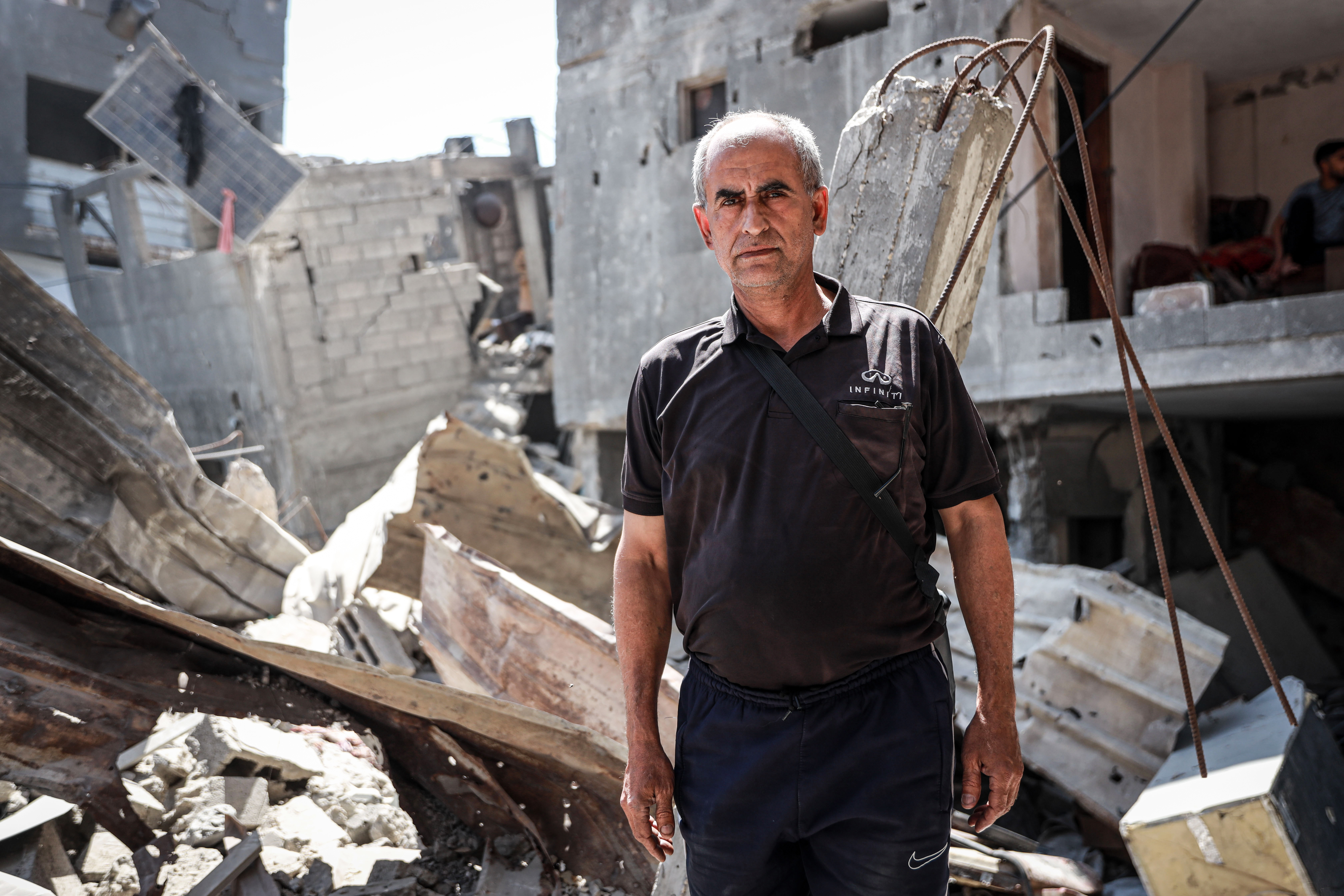Imad Khroub lost his home after an Israeli strike targeted the residential block where he lived in Gaza City’s Shati refugee camp, following an evacuation order issued only minutes before the attack [Abdelhakim Abu Riash/ Al Jazeera]