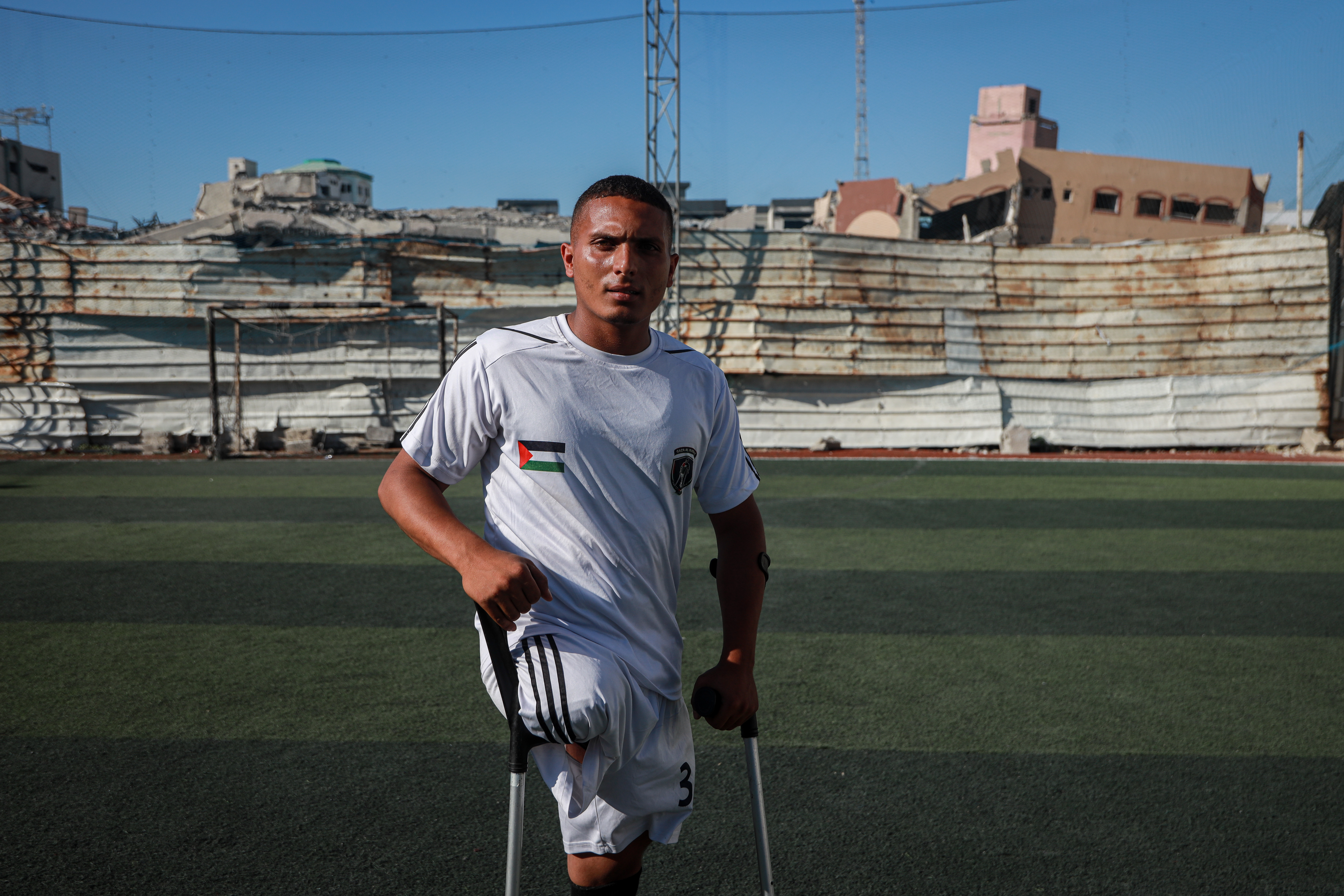 Ali Tafesh, whose leg was amputated during the war on Gaza after he was injured while playing in a local football match with his team, trains during a practice session [Abdelhakim Abu Riash/ Al Jazeera]