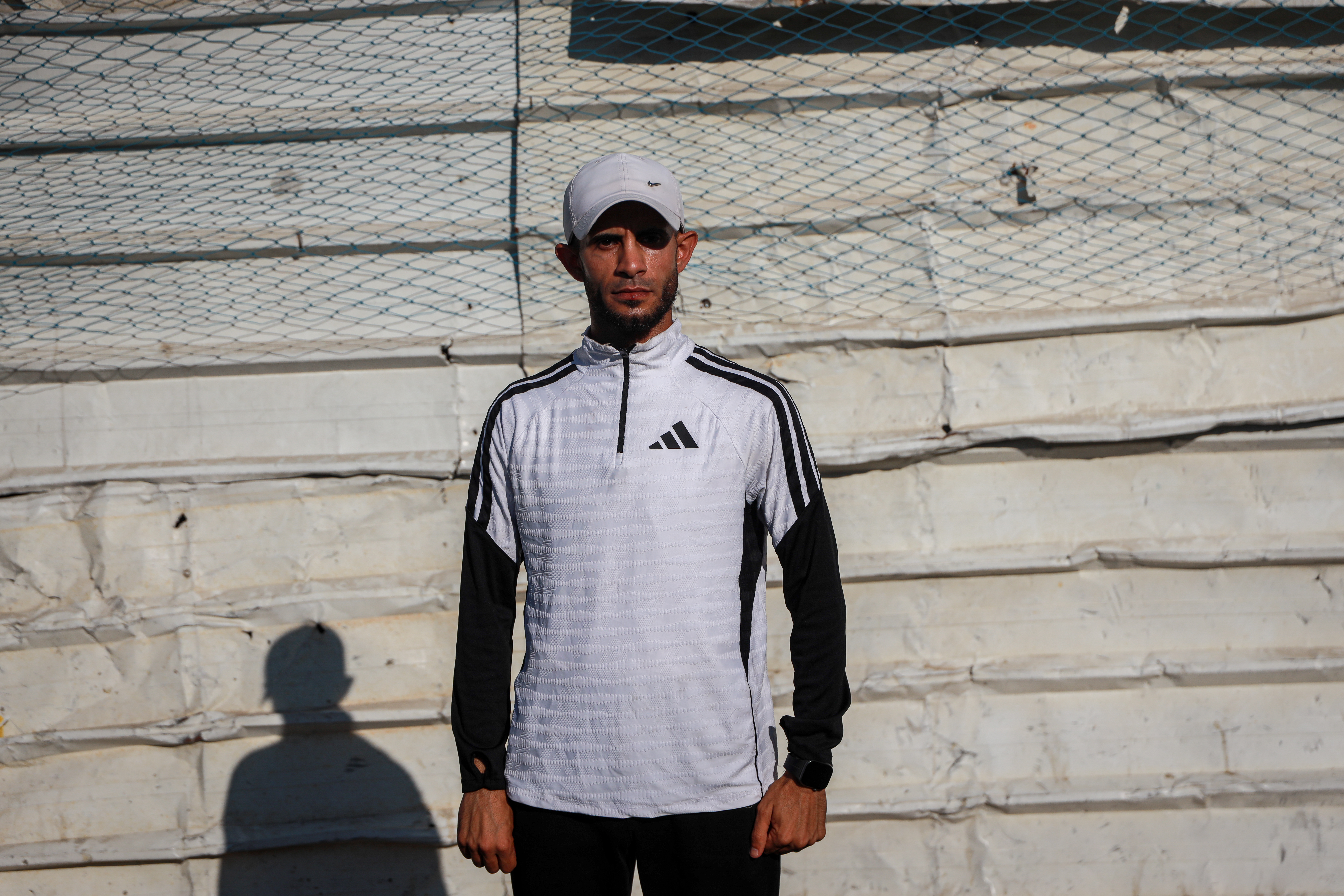Hatem Al-Mughrabi, the team’s coach, expressed his sadness and frustration over the isolation experienced by athletes in Gaza as the World Cup gets underway [Abdelhakim Abu Riash/ Al Jazeera]