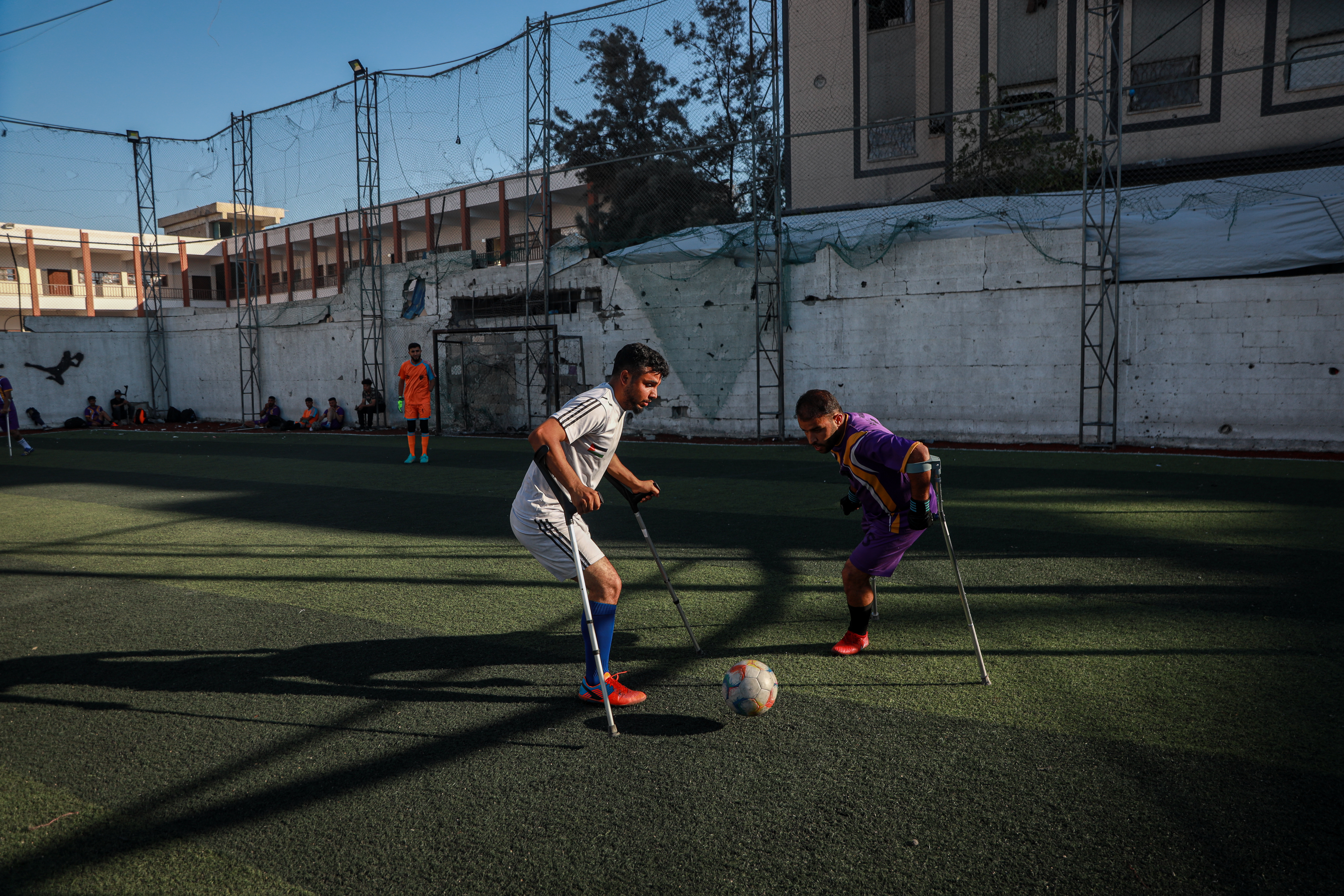 The team includes players who lost limbs during the war, previous military escalations, or other incidents. They speak of the many challenges they face as they strive to continue their sporting careers [Abdelhakim Abu Riash/ Al Jazeera]