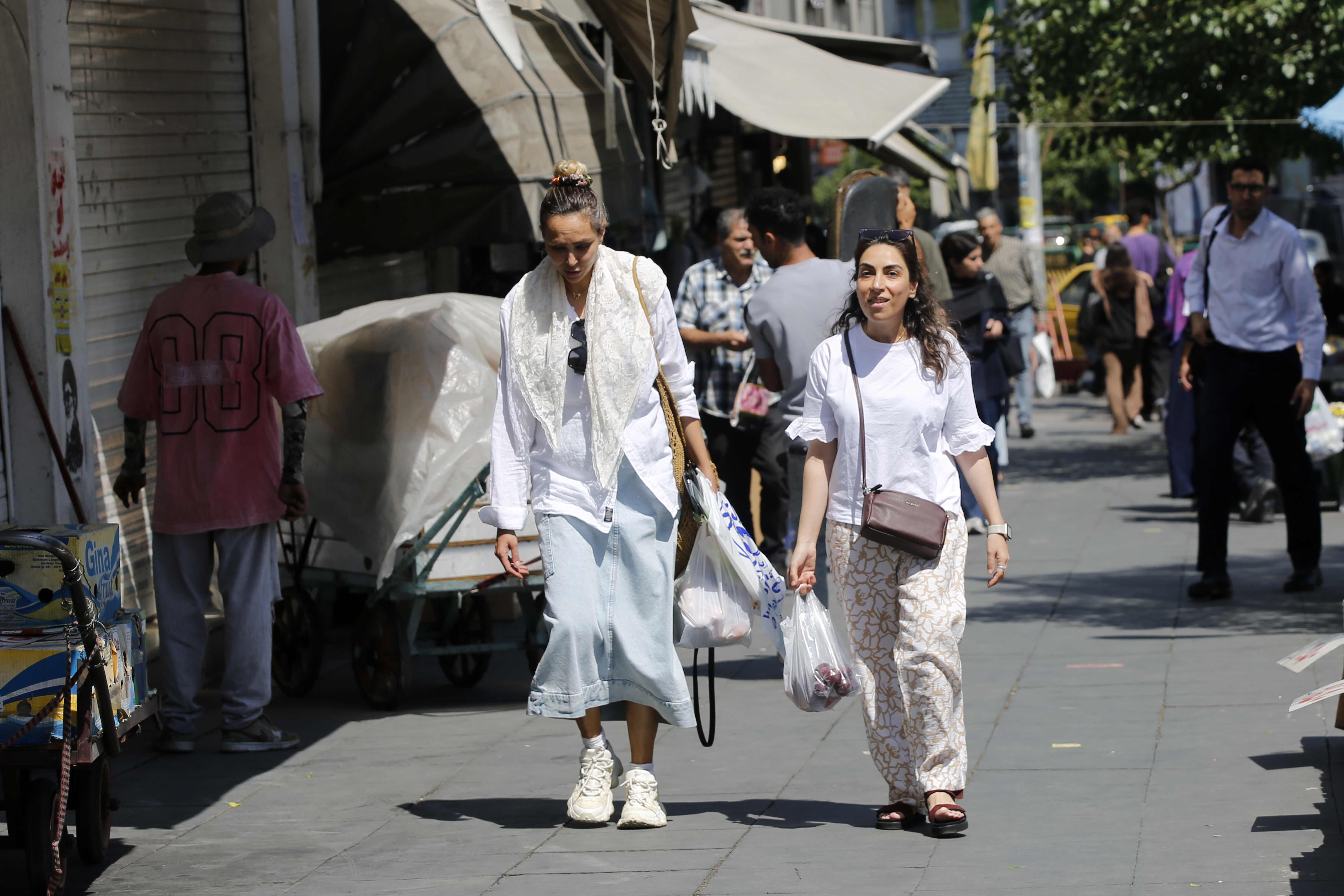 People go about their daily lives as usual in Tehran, Iran