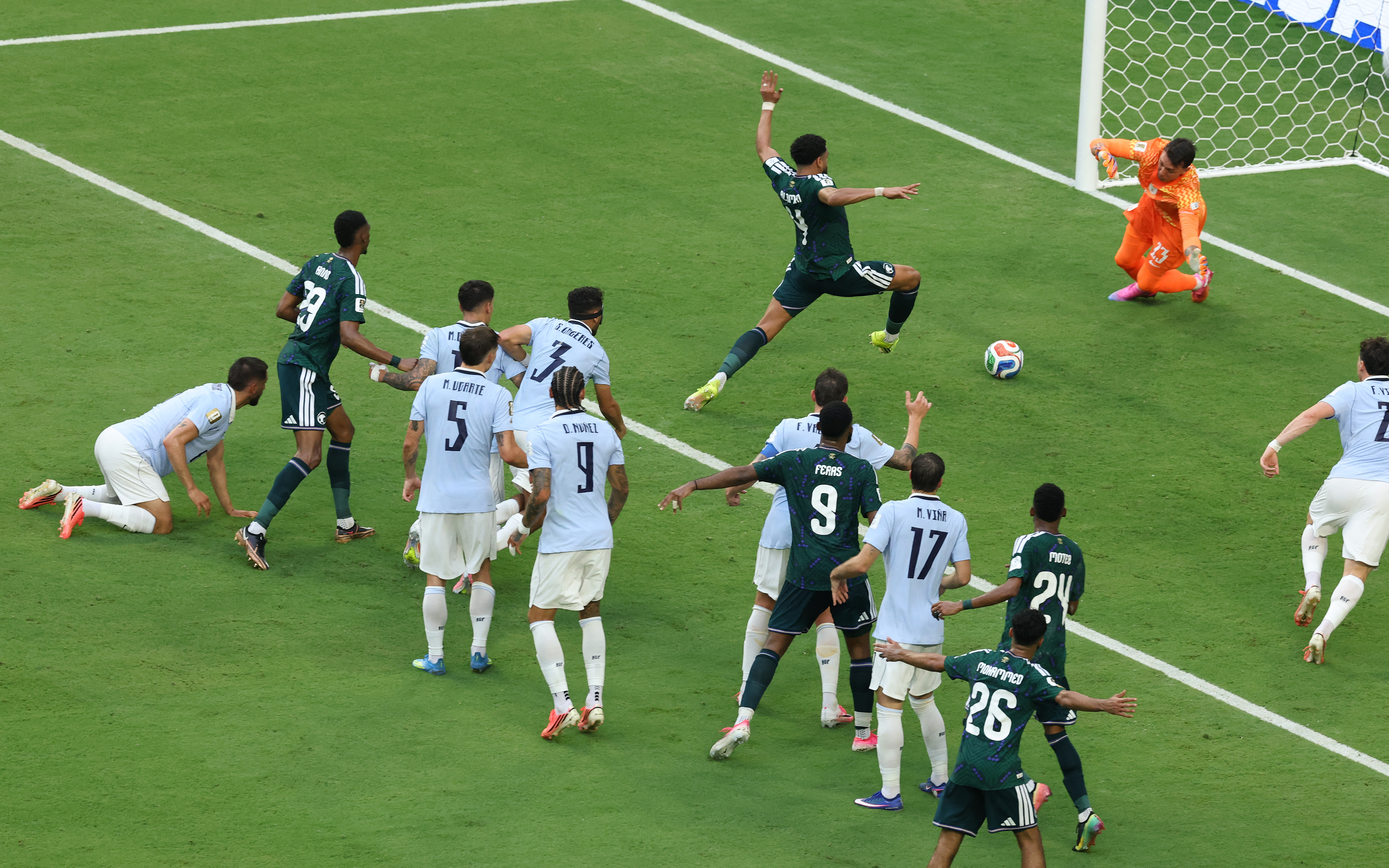 MIAMI, FLORIDA - JUNE 15: Abdulelah Al-Amri #4 of Saudi Arabia scores his team's first goal past Fernando Muslera #23 of Uruguay during the FIFA World Cup 2026 Group H match between Saudi Arabia and Uruguay at Miami Stadium on June 15, 2026 in Miami, Florida. Molly Darlington/Getty Images/AFP (Photo by Molly Darlington / GETTY IMAGES NORTH AMERICA / Getty Images via AFP)