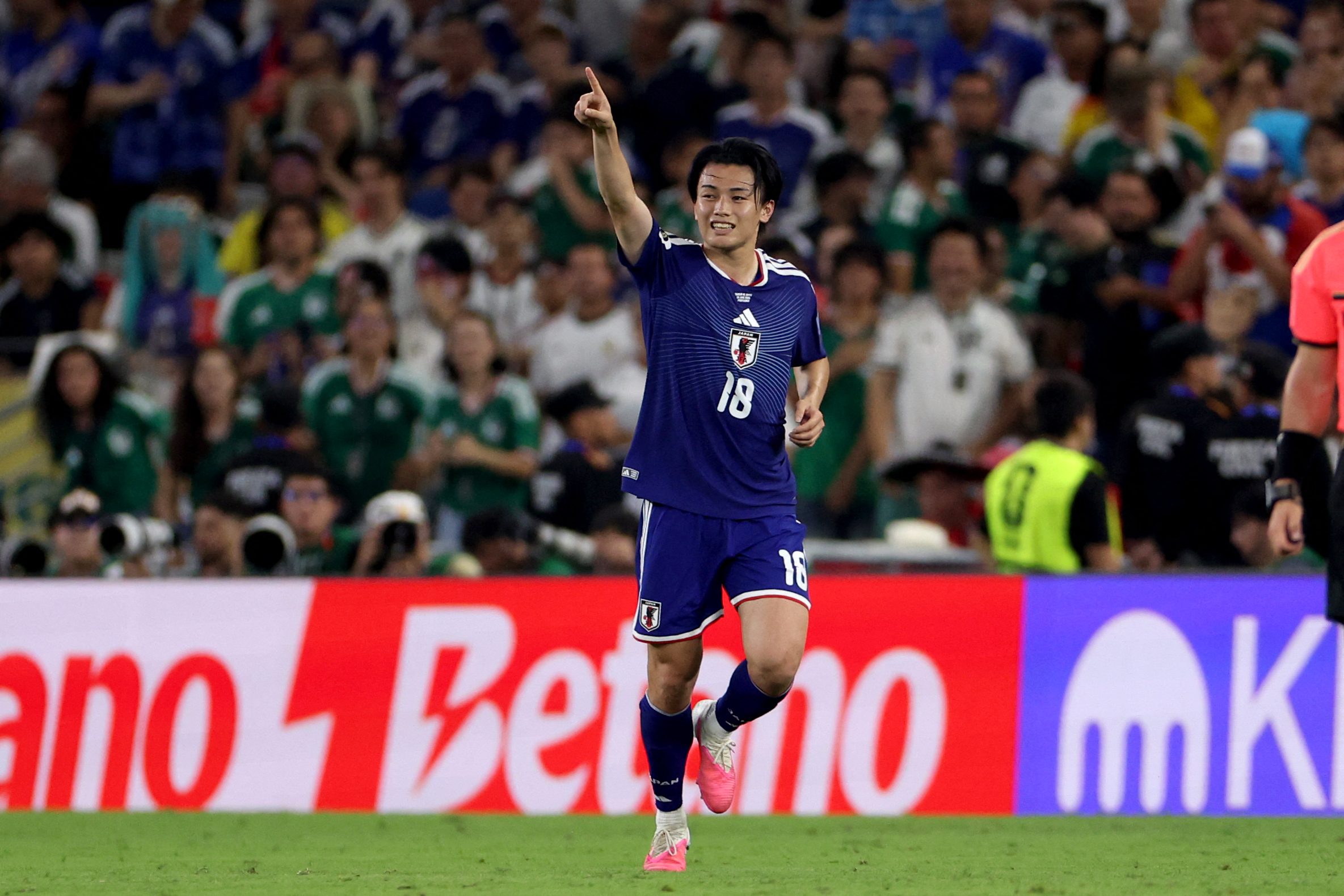 Japan's forward #18 Ayase Ueda celebrates.