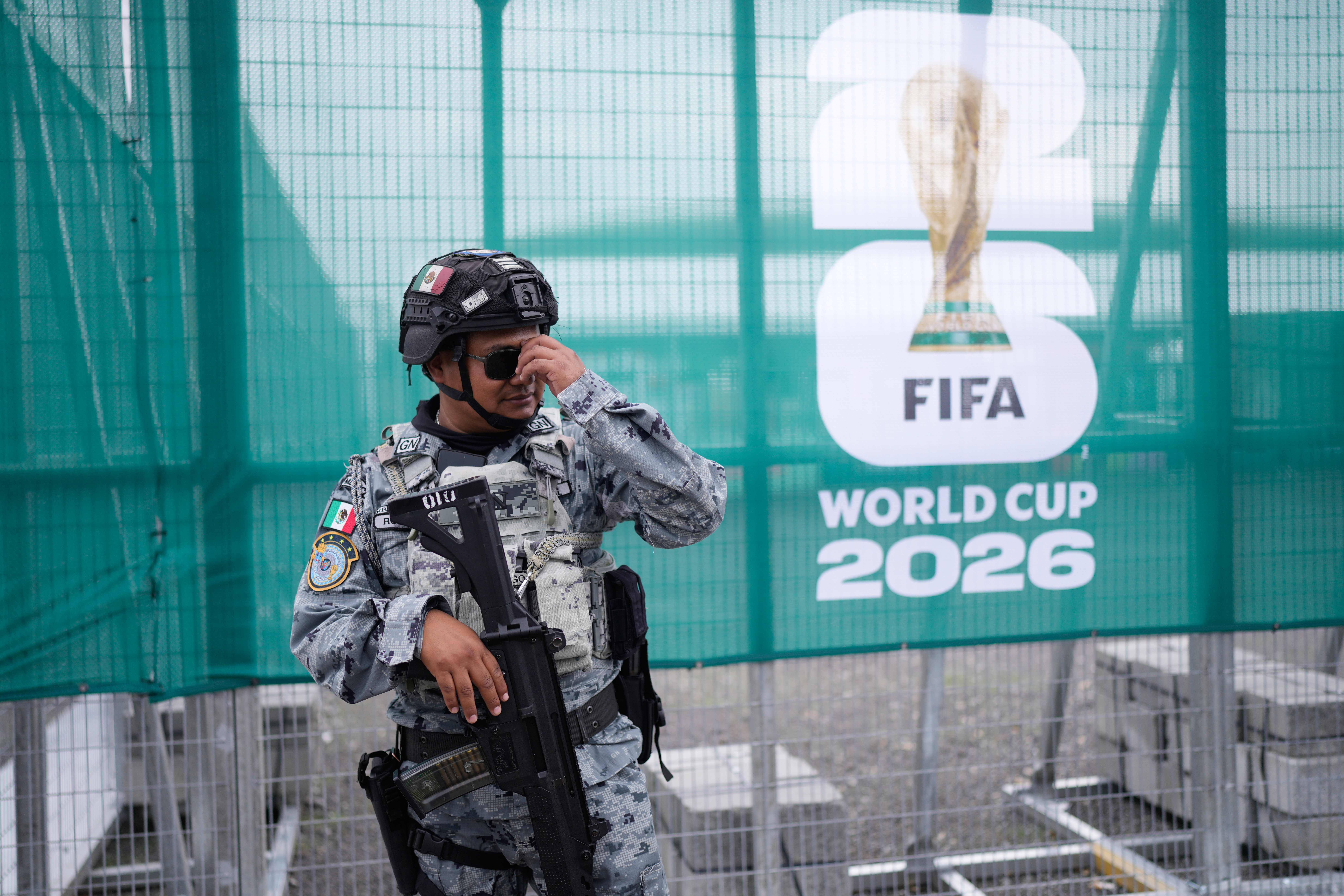 A National Guard officer stands guard outside a stadium that will host FIFA World Cup matches in Guadalajara, Mexico, Tuesday, June 9, 2026. (AP Photo/Matias Delacroix)