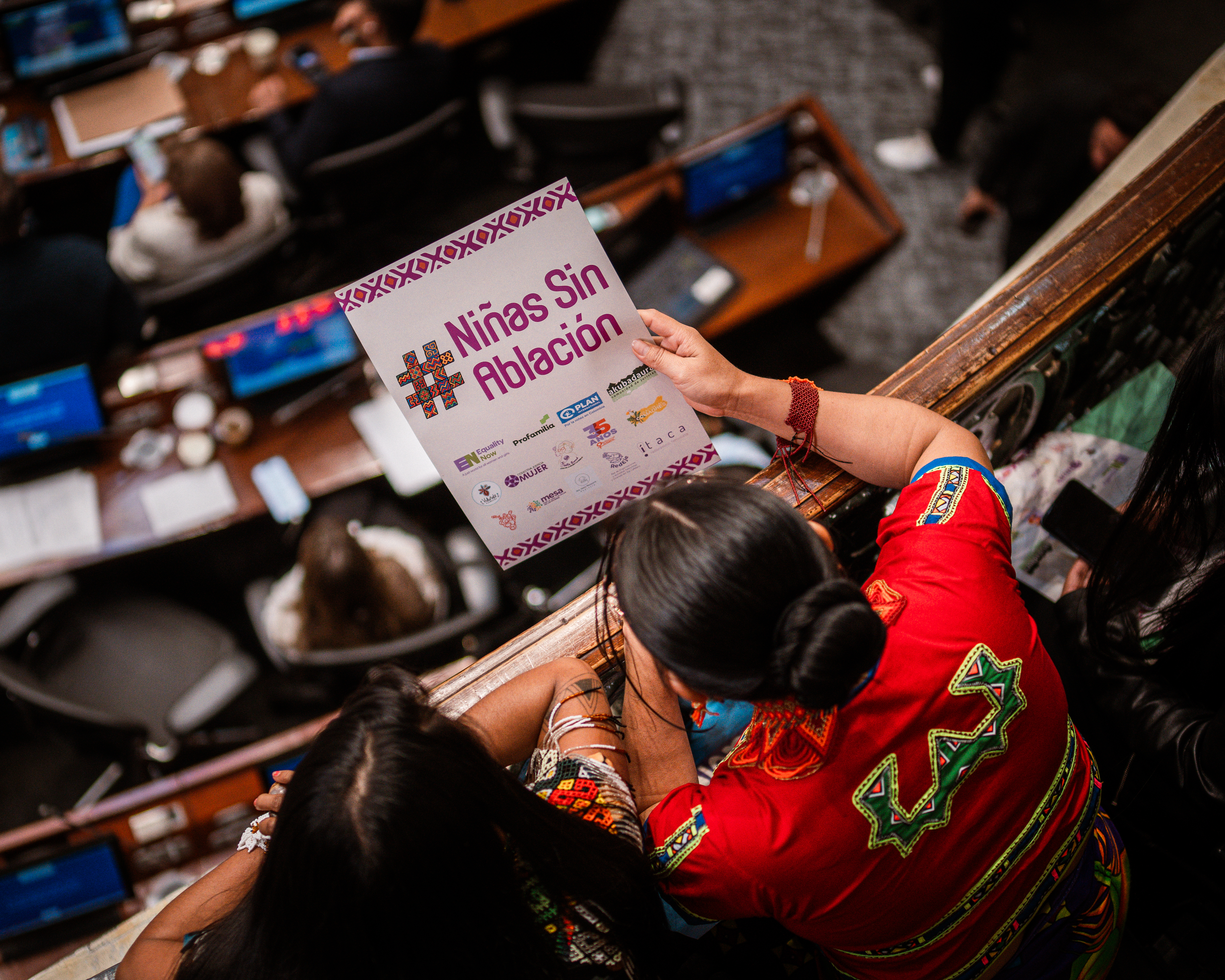 Juliana Domicó awaits the result of the debate on the balcony above the plenary chamber.