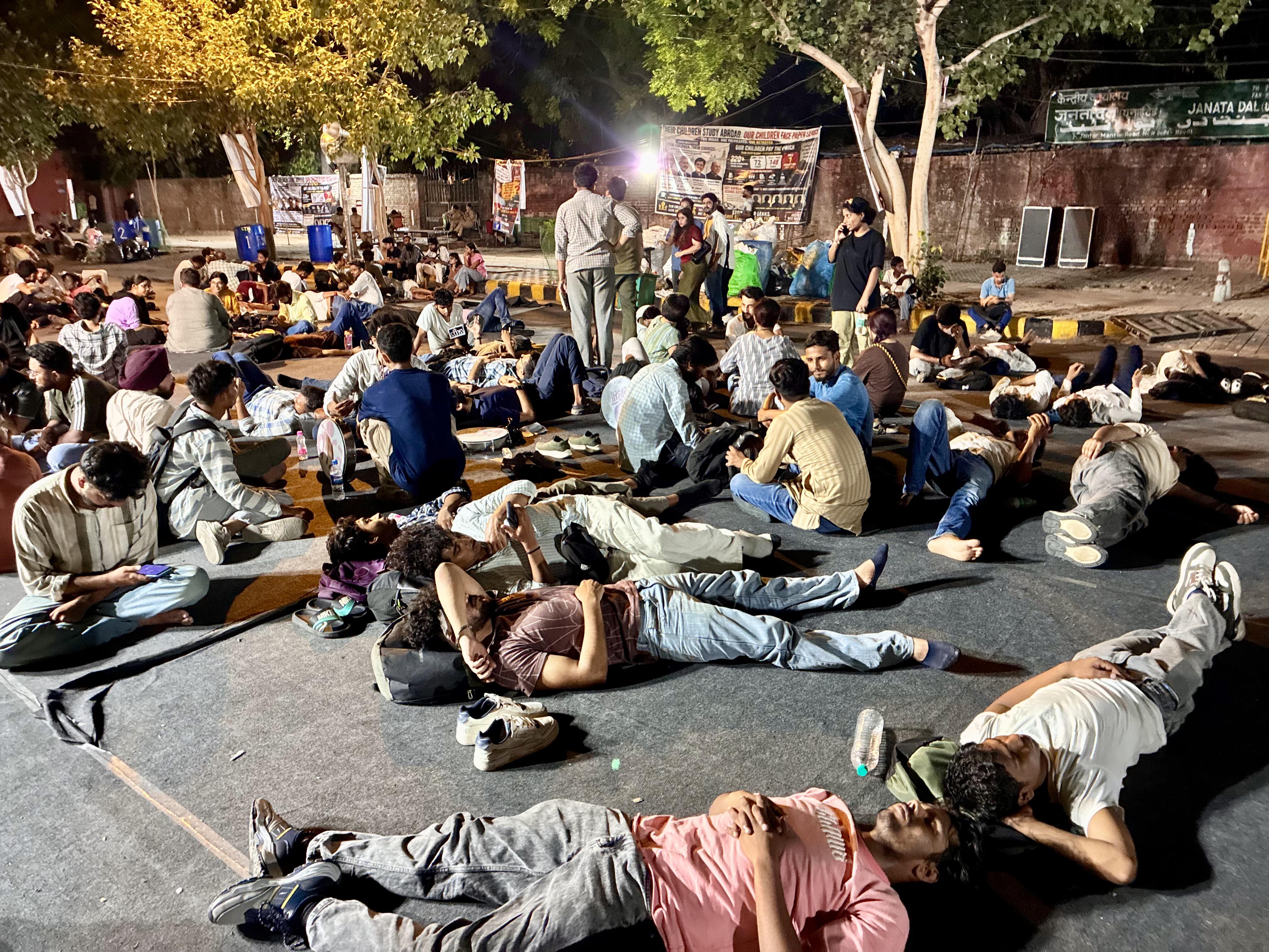 Supporters of the Cockroach Janta Party spend the night at Jantar Mantar in New Delhi after vowing to maintain a round-the-clock protest until the education minister resigns