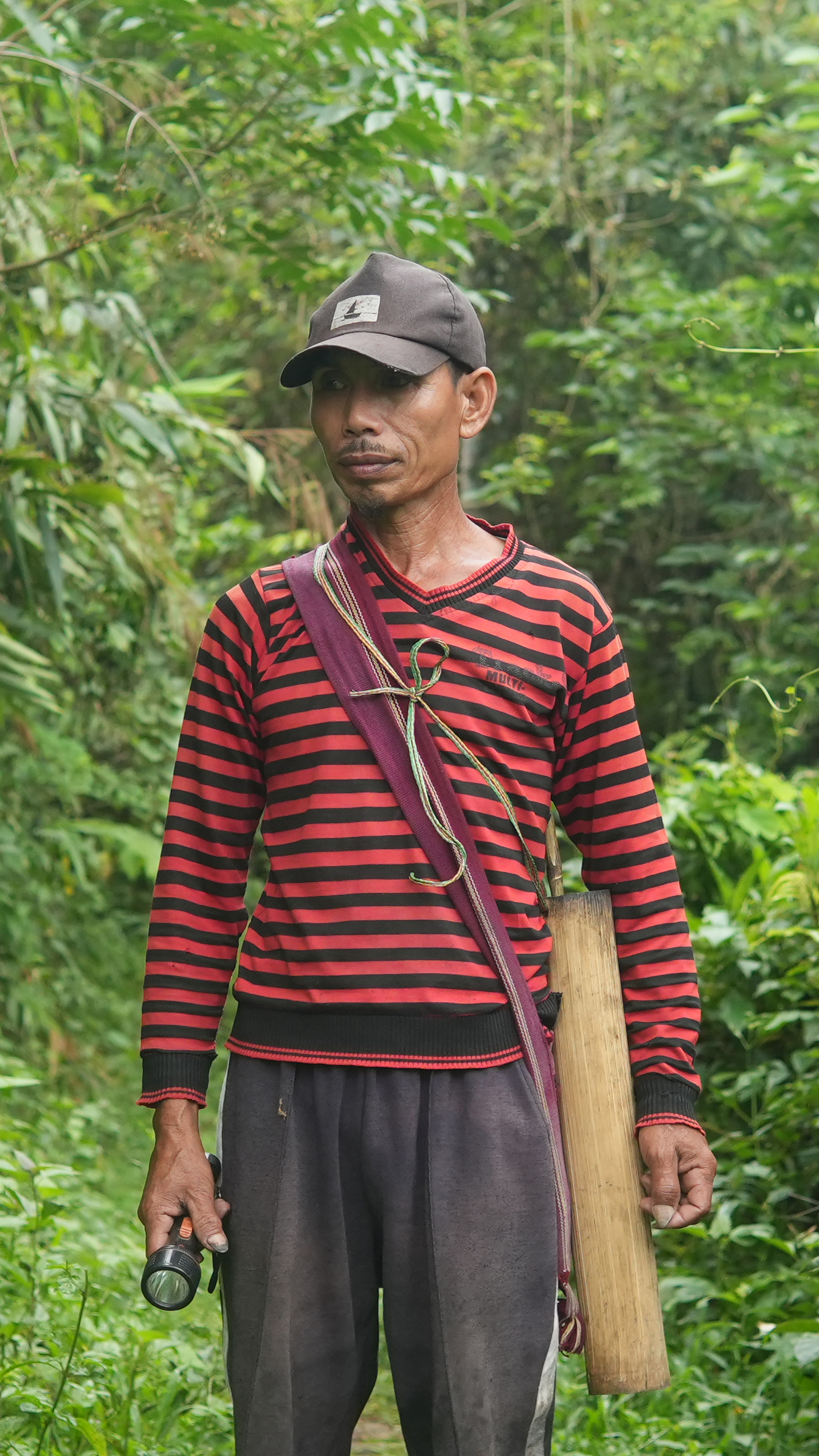 Livingstone "Livi" Marak has spent decades collecting niangtaser, timing his evenings to the insect's brief appearance above ground [Ashutosh Kumar/Al Jazeera]