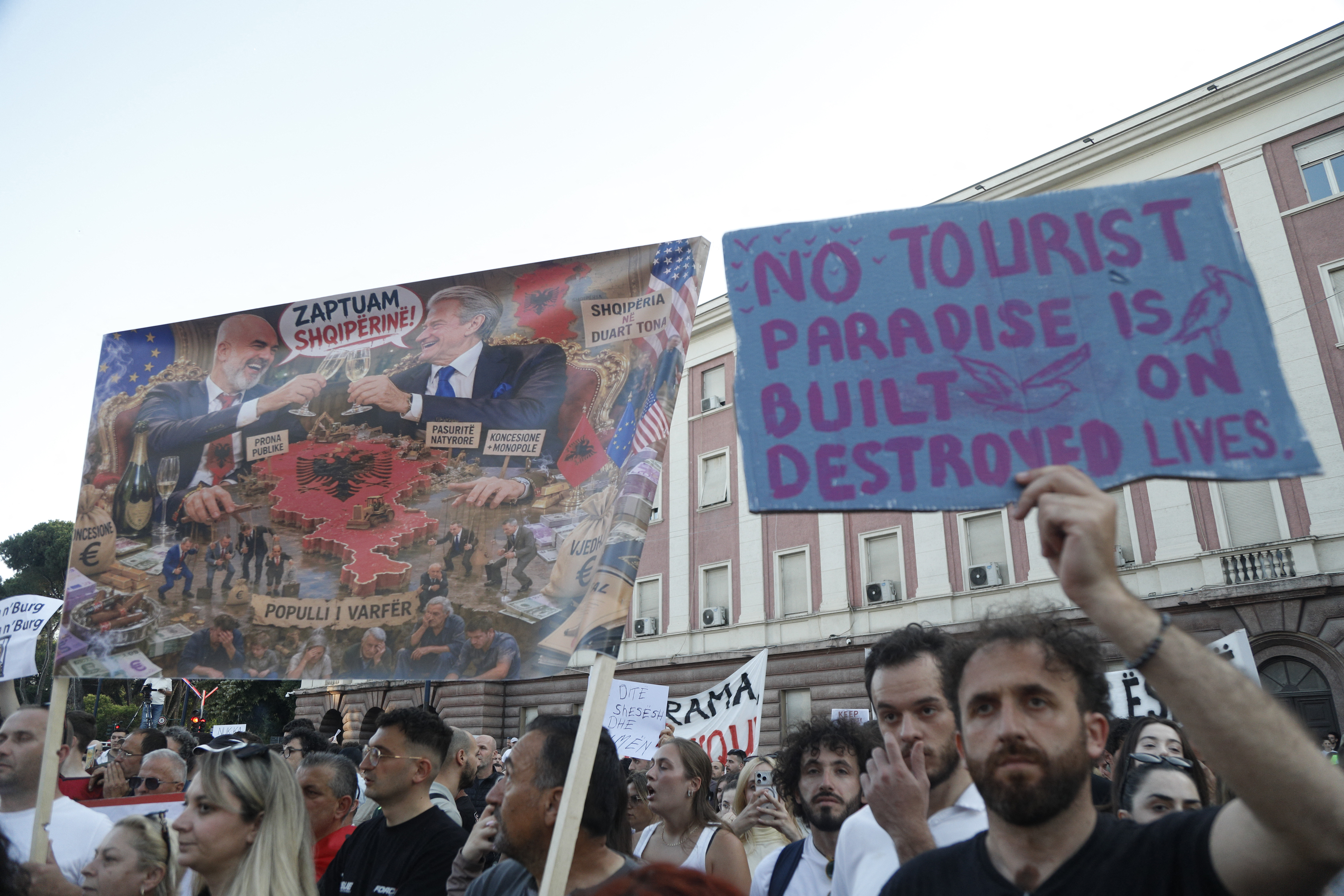 Protestors take part in a demonstration in front of the prime minister's office, against the construction of a luxury resort near a protected natural area, in Tirana on June 2, 2026.