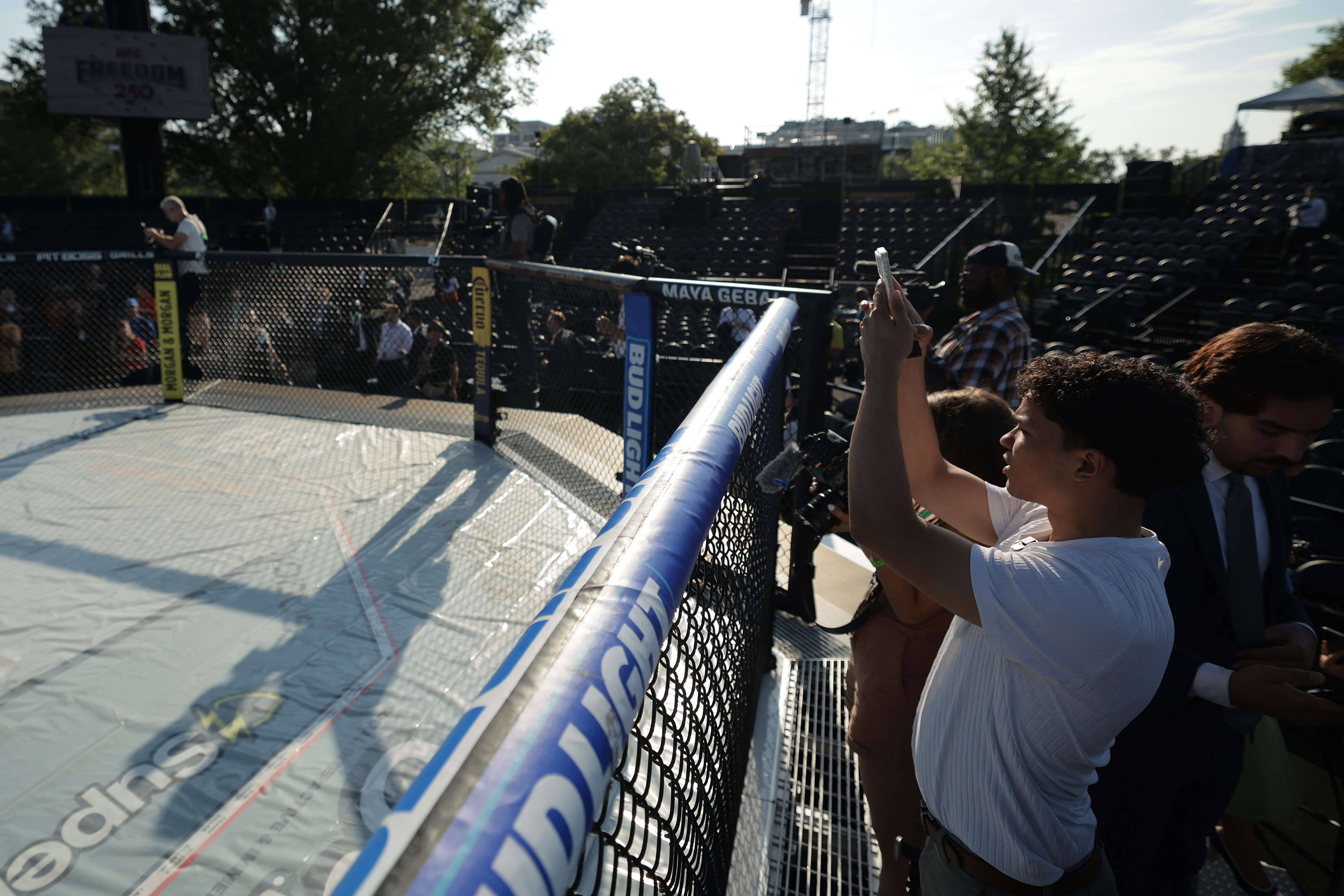 WASHINGTON, DC - JUNE 11: Journalists participate in a preview of the Ultimate Fighting Championship (UFC) "Claw" and the octagon fighting ring on the South Lawn of the White House on June 11, 2026 in Washington, DC. President Donald Trump is hosting a series of Ultimate Fighting Championship matches on the South Lawn on Flag Day and his 80th birthday, June 14, which the White House is calling "a once-in-a-generation celebration of the American fighting spirit." Chip Somodevilla/Getty Images/AFP (Photo by CHIP SOMODEVILLA / GETTY IMAGES NORTH AMERICA / Getty Images via AFP)