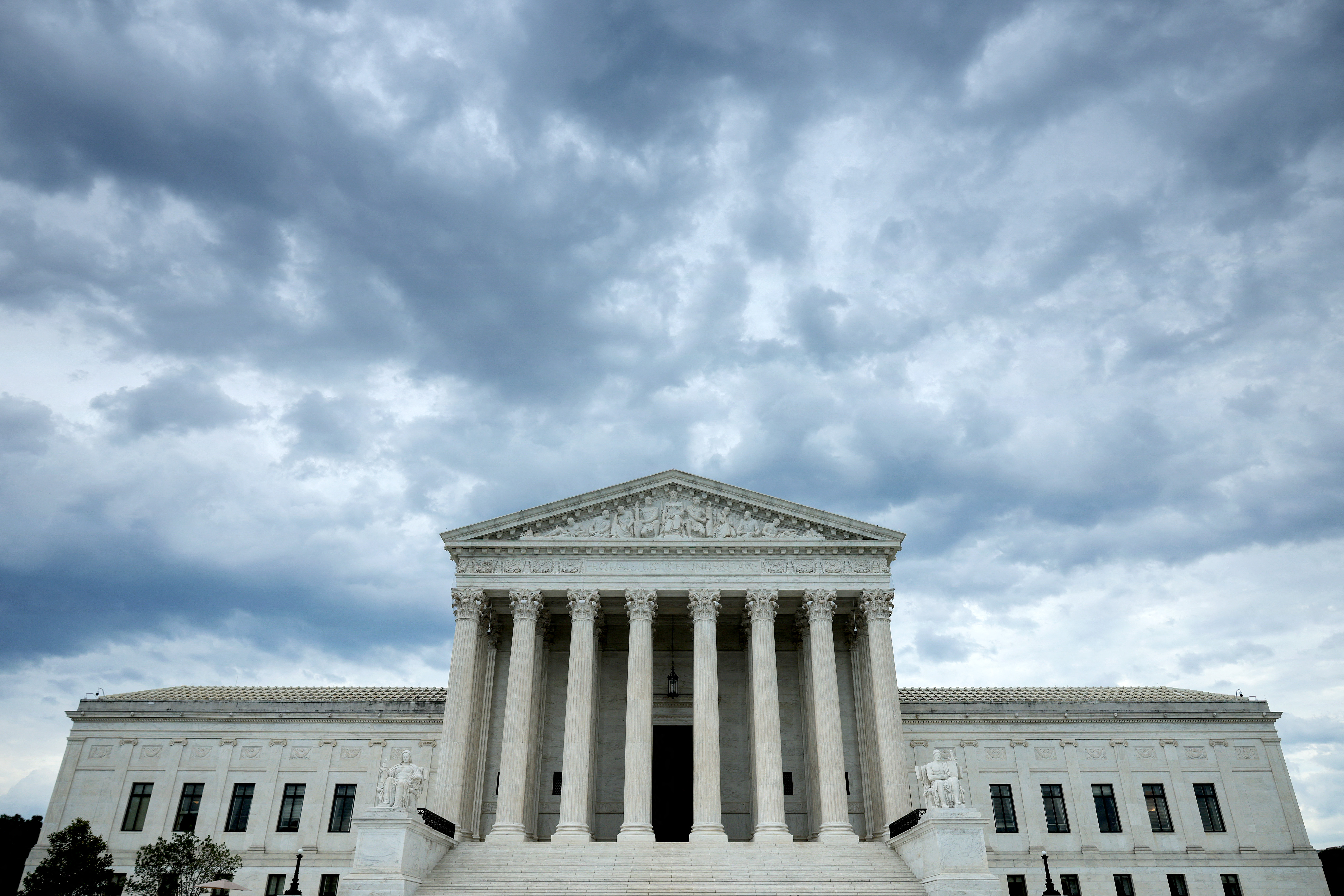 WASHINGTON, DC - JUNE 18: Rain clouds roll over the United States Supreme Court building on June 18, 2026 in Washington, DC. The high court handed down three decisions Thursday, including United States v Hemani where the court ruled 9-0 to limit a federal ban on drug users' Second Amendment right to own firearms. Chip Somodevilla/Getty Images/AFP (Photo by CHIP SOMODEVILLA / GETTY IMAGES NORTH AMERICA / Getty Images via AFP)
