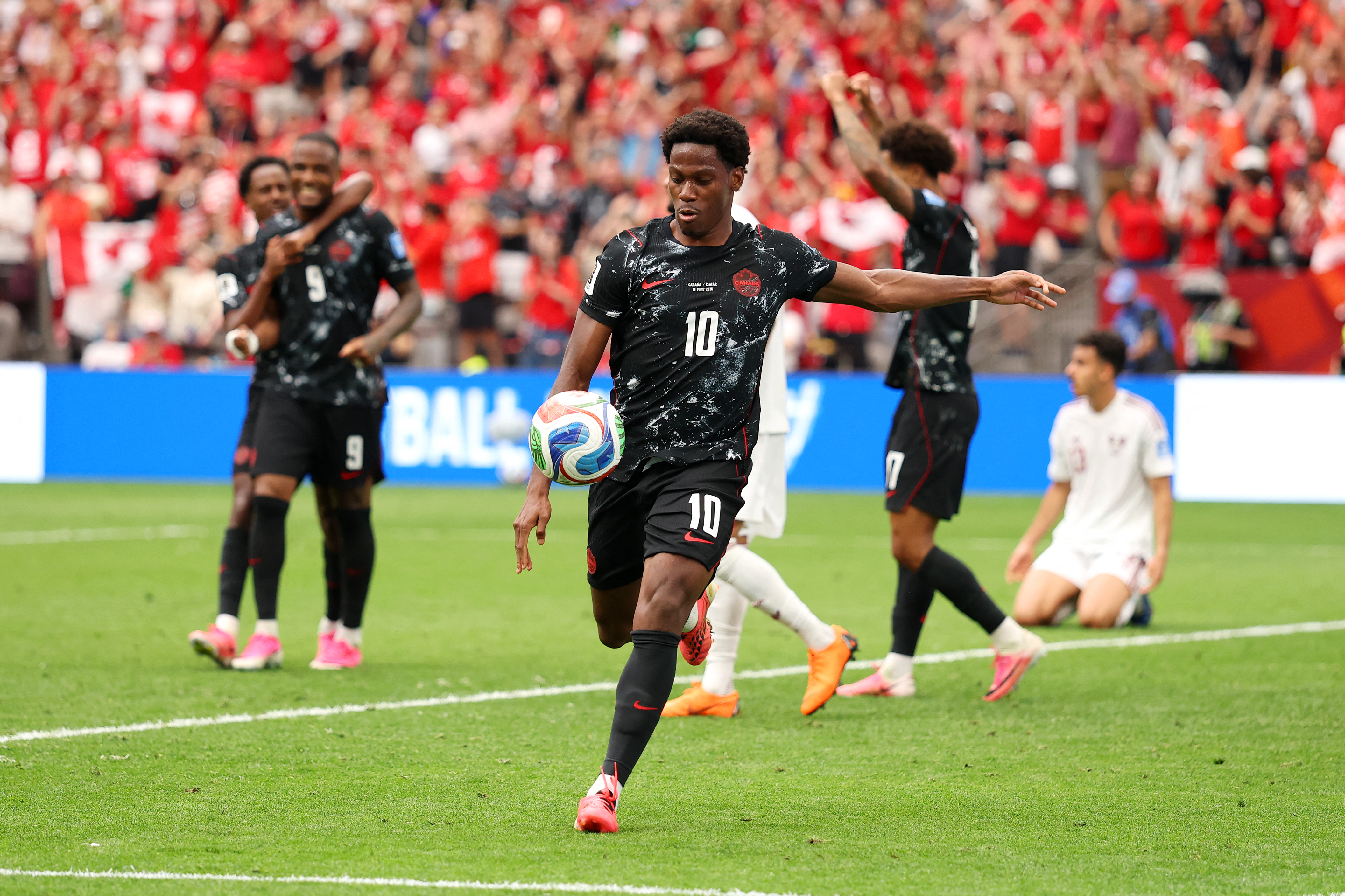 VANCOUVER, BRITISH COLUMBIA - JUNE 18: Jonathan David #10 of Canada celebrates scoring his team's second goal during the FIFA World Cup 2026 Group B match between Canada and Qatar at BC Place Vancouver on June 18, 2026 in Vancouver, British Columbia. Fran Santiago/Getty Images/AFP (Photo by Fran Santiago / GETTY IMAGES NORTH AMERICA / Getty Images via AFP)