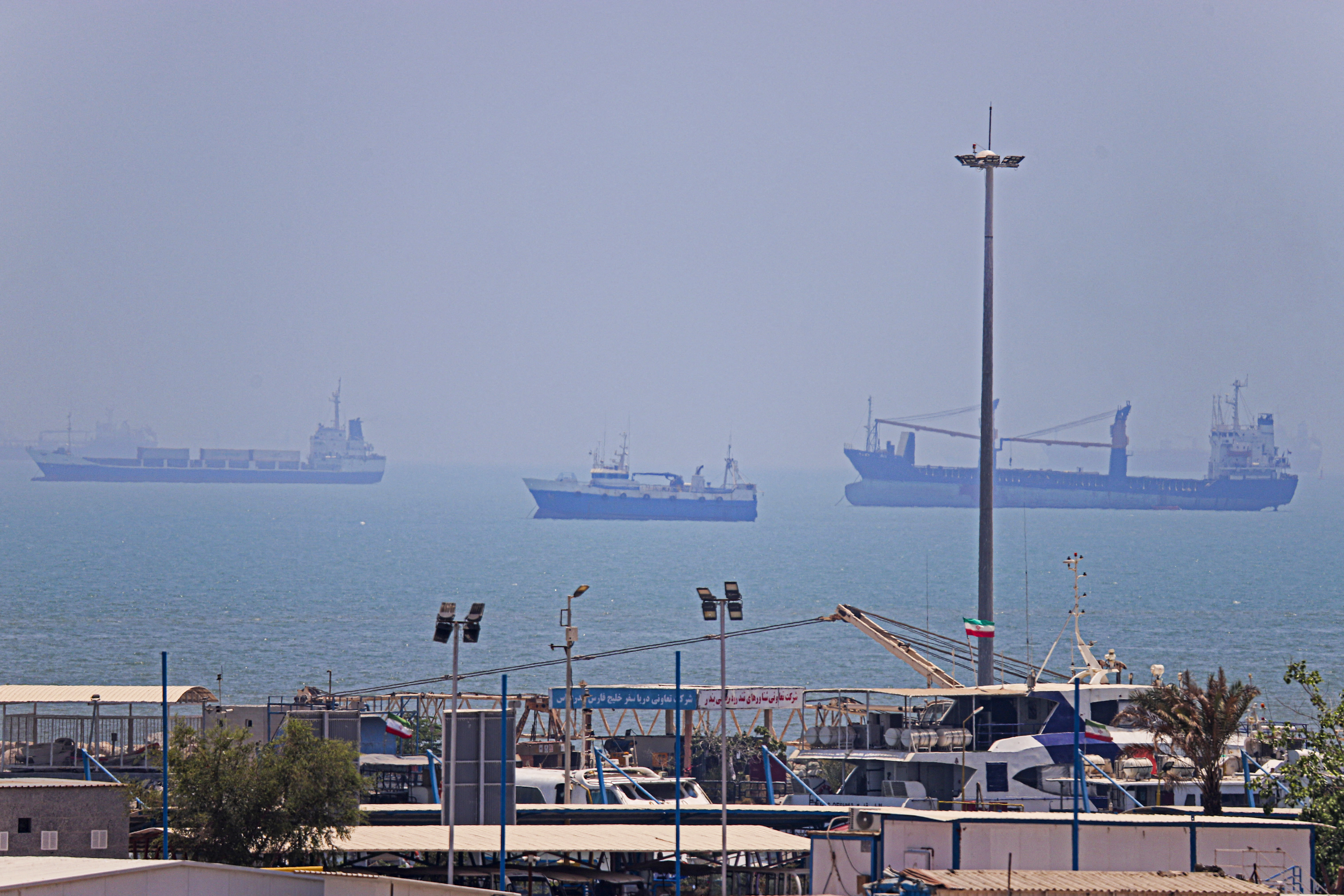 In this picture obtained from Iran's ISNA news agency on June 18, 2026, vessels are seen anchored in Bandar Abbas along the Strait of Hormuz.