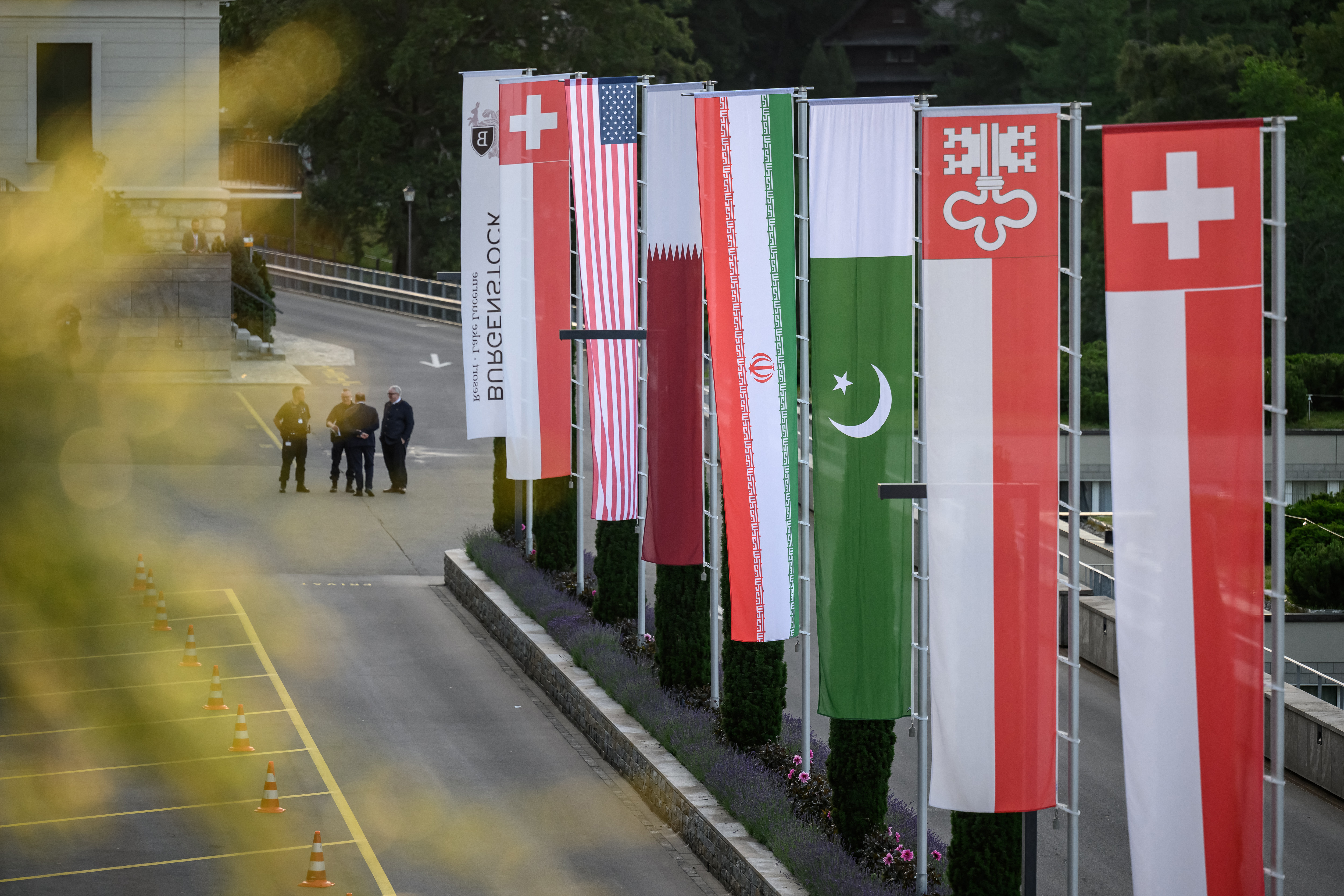 Flags of Switzerland, United States, Qatar, Pakistan and local Swiss canton of Nidwalden are photographed.