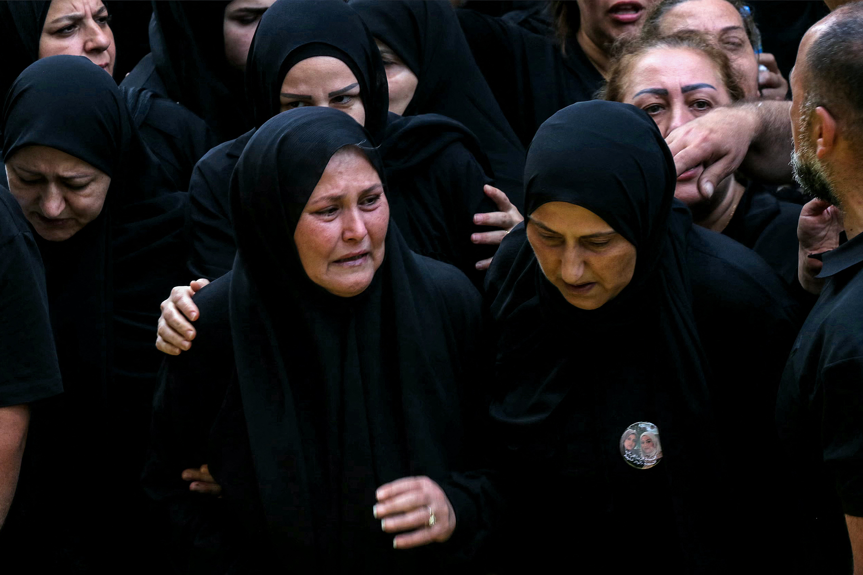EDITORS NOTE: Graphic content / Mourners attend the funeral of four women who were killed the previous day following Israeli bombardment on the village of Qannarit, south of Sidon in southern Lebanon, in the village on June 21, 2026.