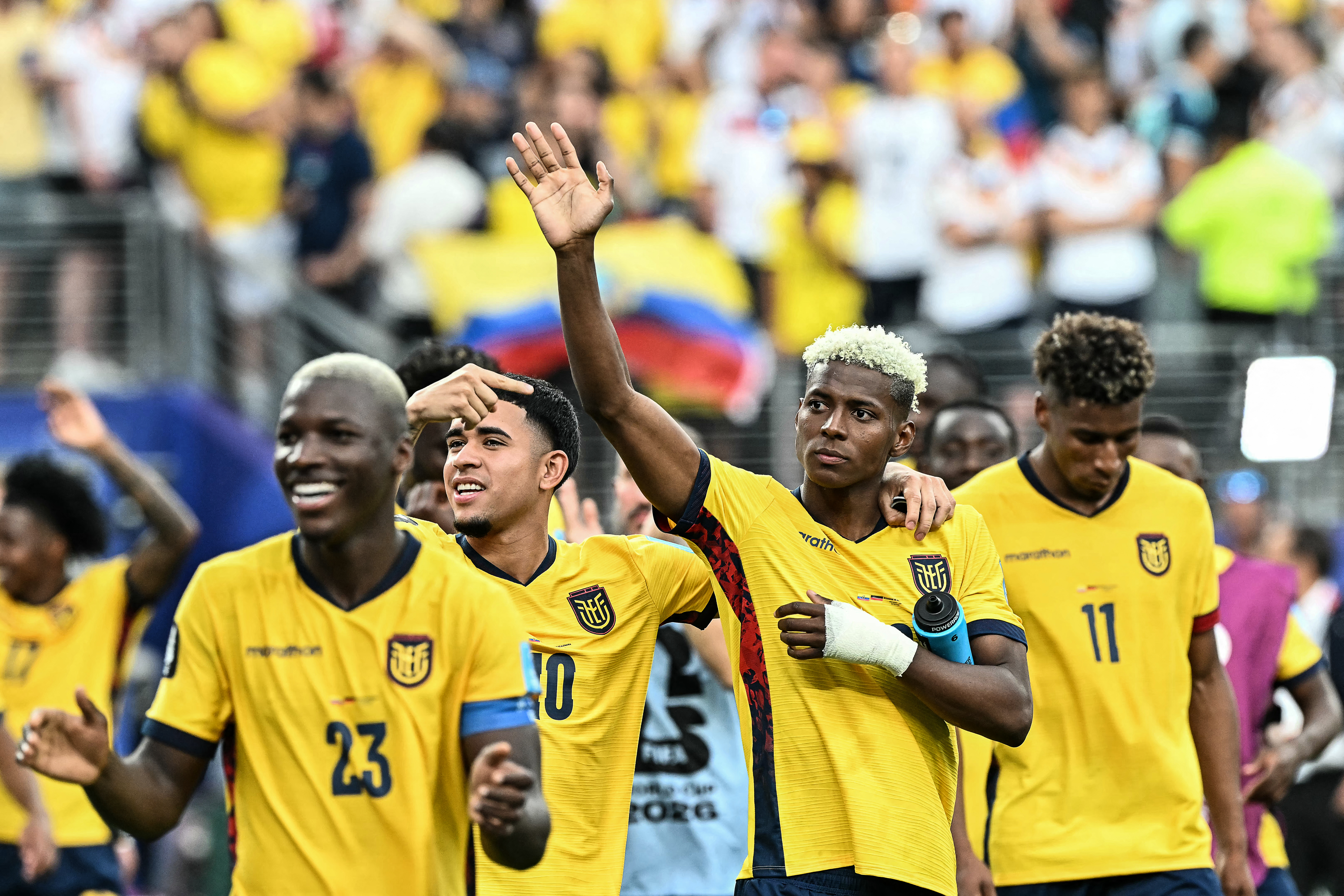 Ecuador's midfielder #10 Kendry Paez (C-L) and forward #20 Nilson Angulo (C-R) celebrate after winning the 2026 World Cup Group E football match between Ecuador and Germany at the New York/New Jersey Stadium in East Rutherford on June 25, 2026. (Photo by Jewel SAMAD / AFP)