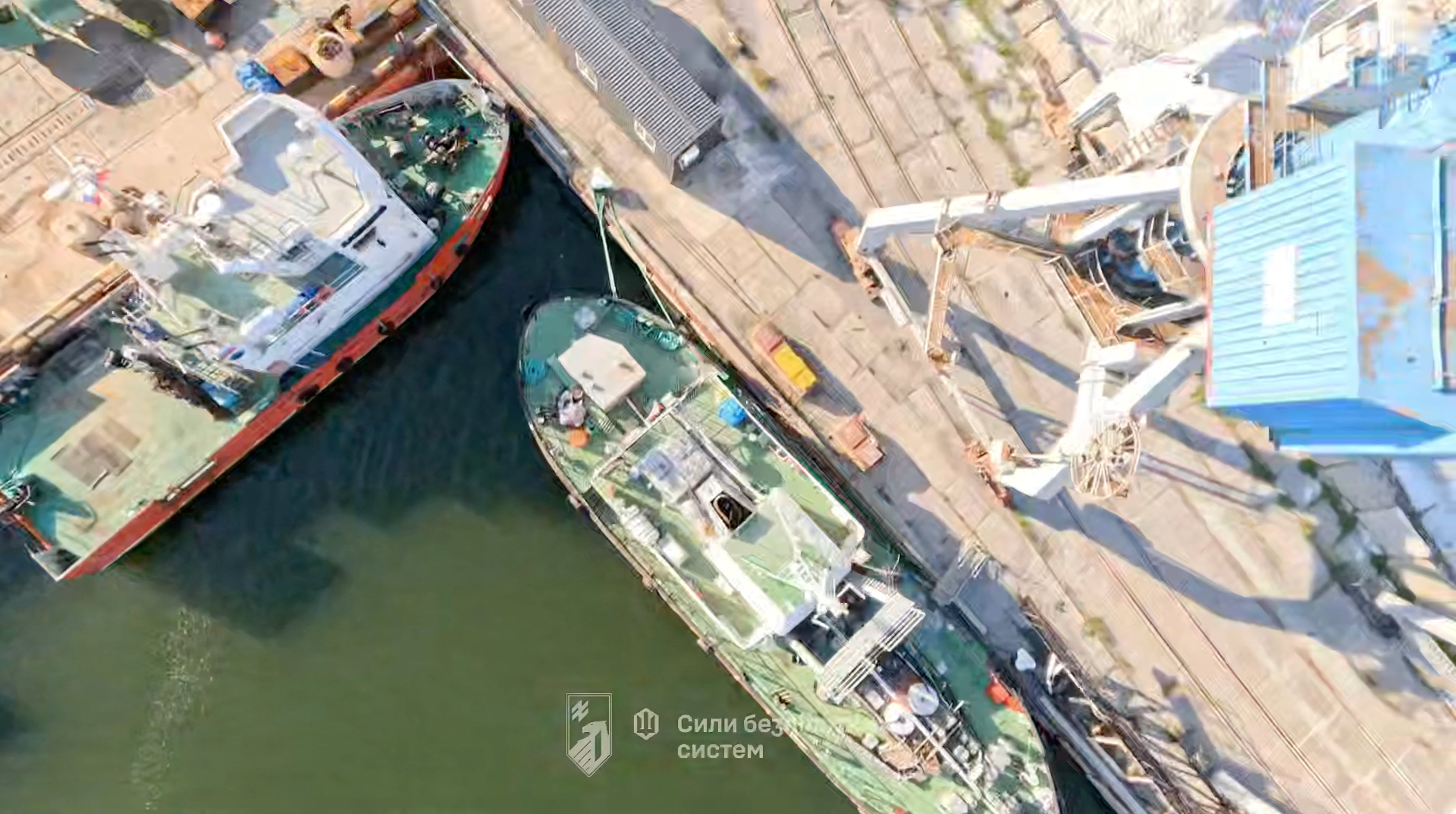 Drone view of port infrastructure, as Ukrainian forces struck several key facilities at the Russian-occupied port of Mariupol, which Kyiv said was an attack that has "significantly limited" its capacity as a critical logistics hub for Moscow's war effort, in Mariupol, Donetsk Region, Russian-Controlled Ukraine, in this screen grab obtained from a handout video released June 10, 2026. 1st Azov Corps/Handout via REUTERS THIS IMAGE HAS BEEN SUPPLIED BY A THIRD PARTY. MANDATORY CREDIT. TEXT OVERLAY FROM SOURCE. VERIFICATION -Location confirmed for part of the video from shape of port, buildings and equipment which matched archive and satellite imagery of the area -Date could not be verified. -Kyiv said on June 10 Ukrainian forces had struck several key facilities at the Mariupol but did not date the attacks