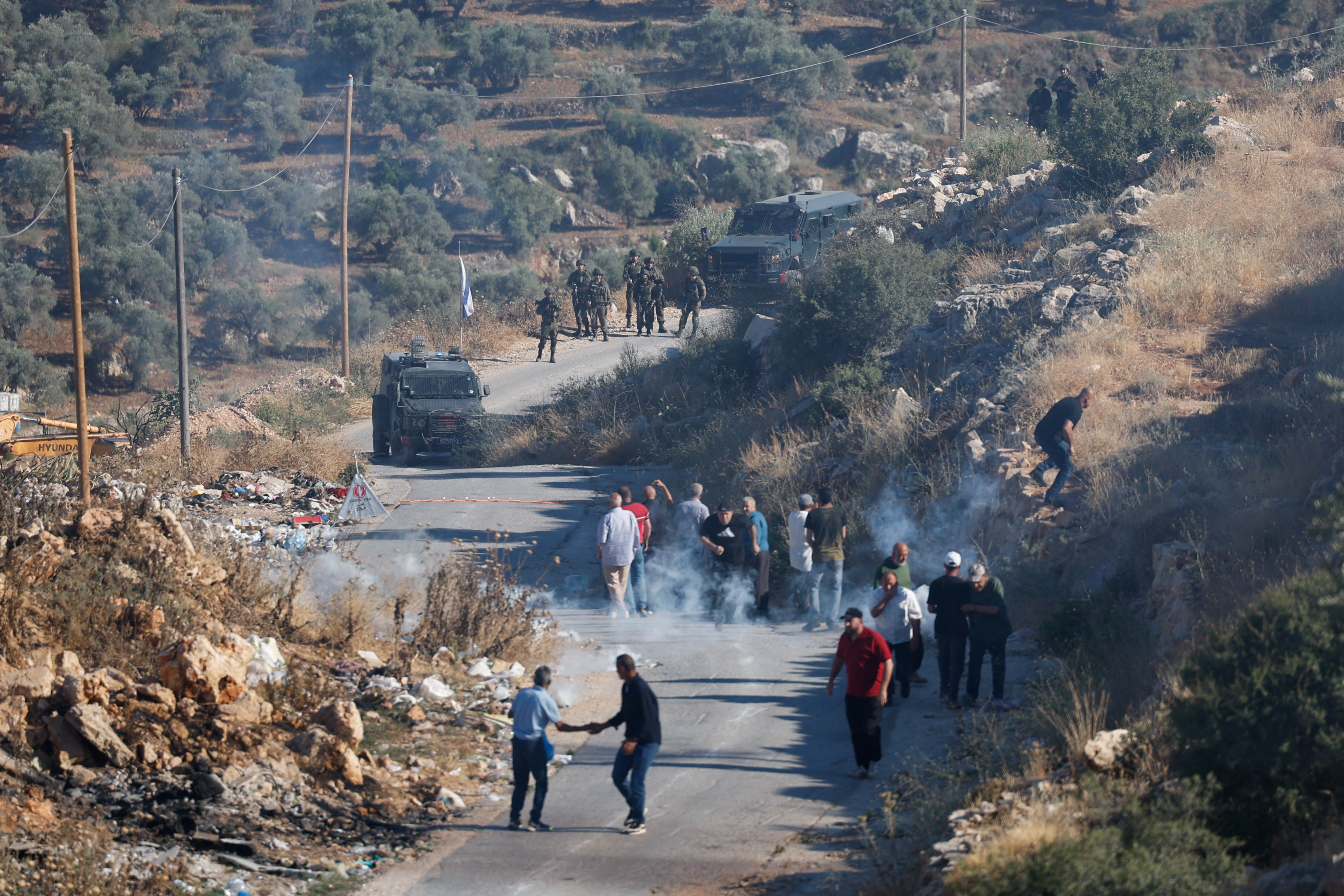 Israeli soldiers fire tear gas at Palestinians during a protest against a new Israeli settlement in the West Bank village of Deir Abu Mishal, near Ramallah, in the Israeli-occupied West Bank, June 13, 2026. REUTERS/Mohammed Torokman