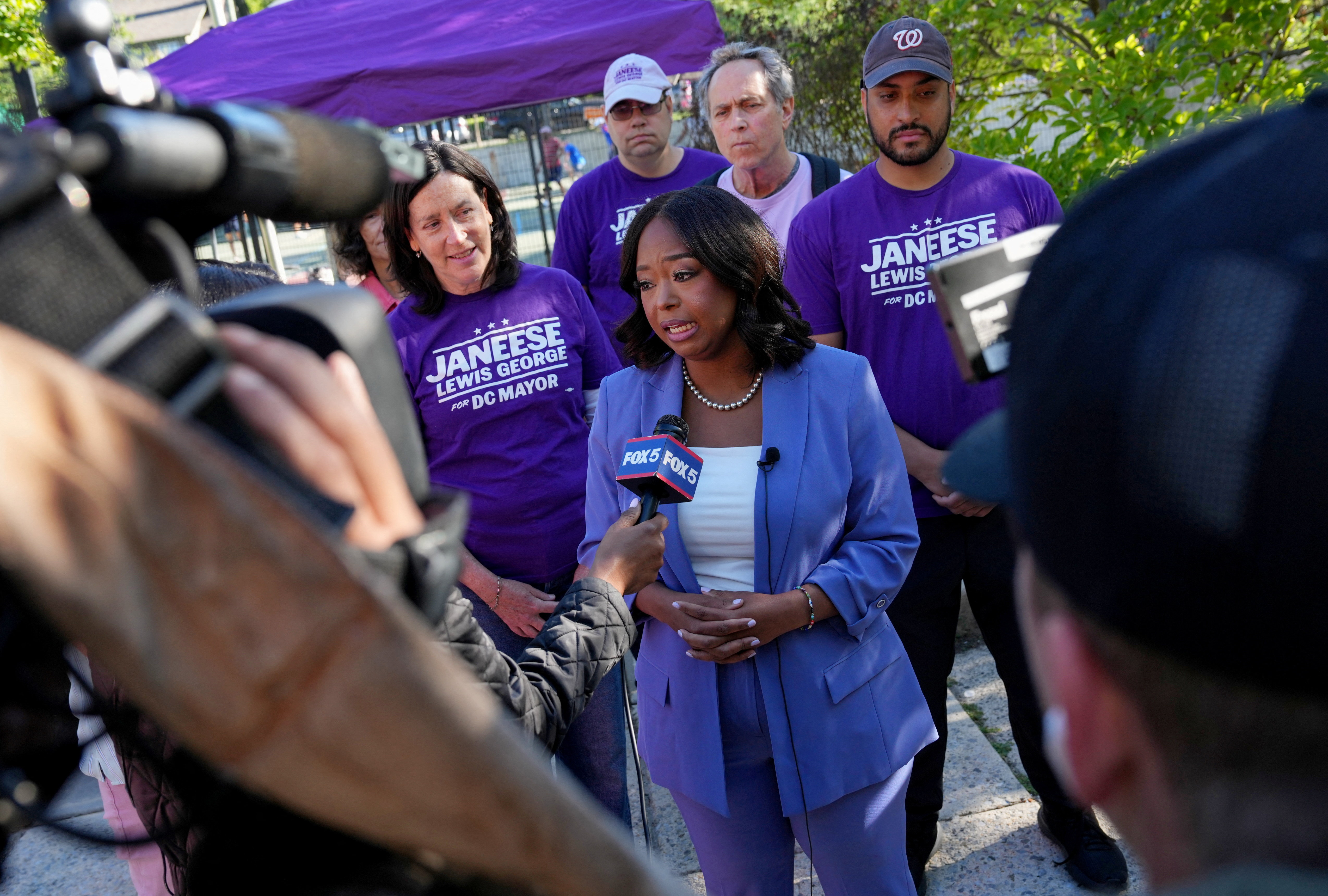 DC Mayoral candidate Janeese Lewis George gives an interview with members of the news media next to a voting site at the Chevy Chase Community Center during DC’s primary voting day in Washington, D.C., U.S., June 16, 2026. REUTERS/Leah Millis