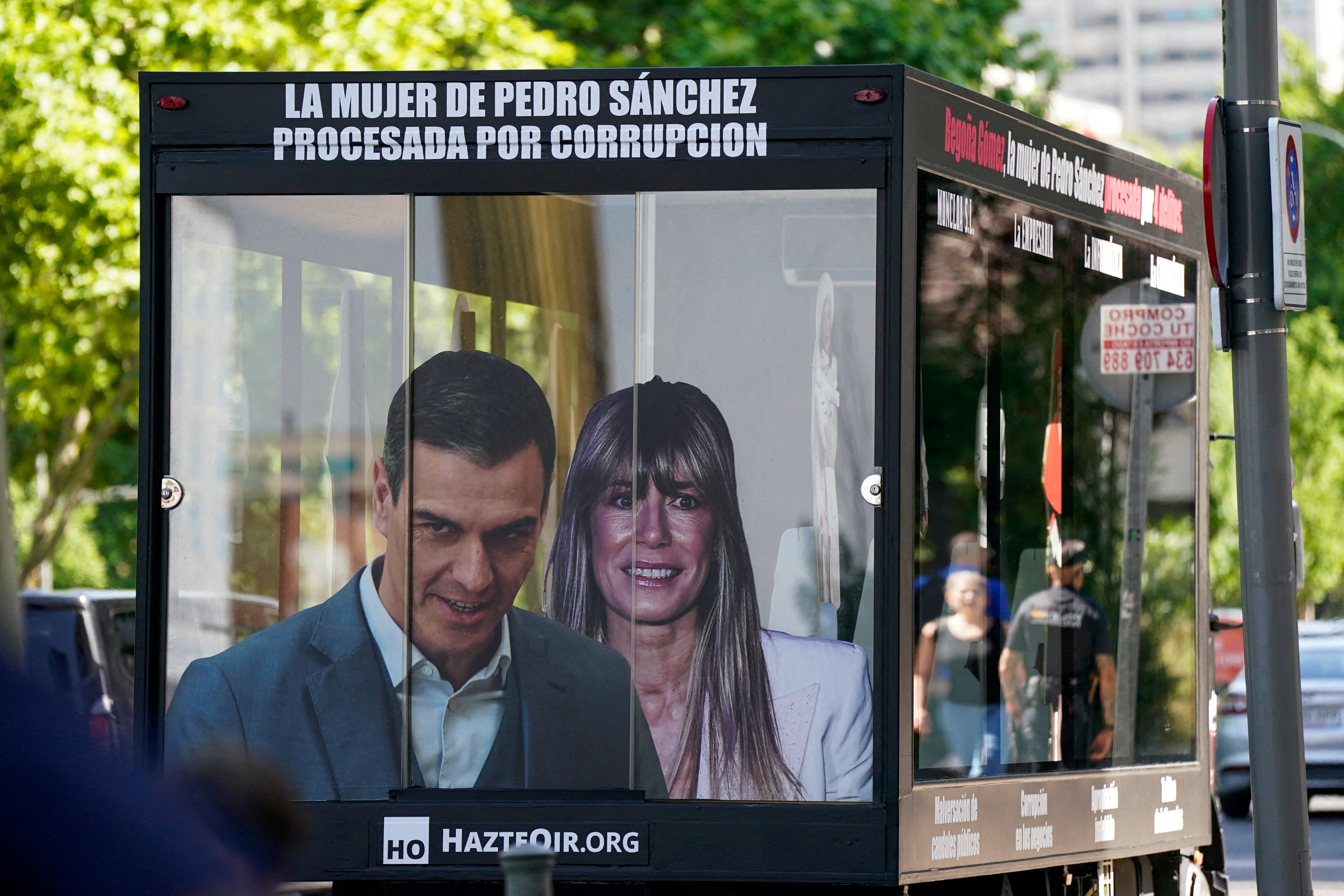 FILE PHOTO: A truck displaying images of Spanish Prime Minister Pedro Sanchez and his wife Begona Gomez drives outside the court as a way of protest on the day Gomez appears in court to testify as part of influence-peddling investigation, in Madrid, Spain, June 15, 2026. REUTERS/Ana Beltran/File Photo