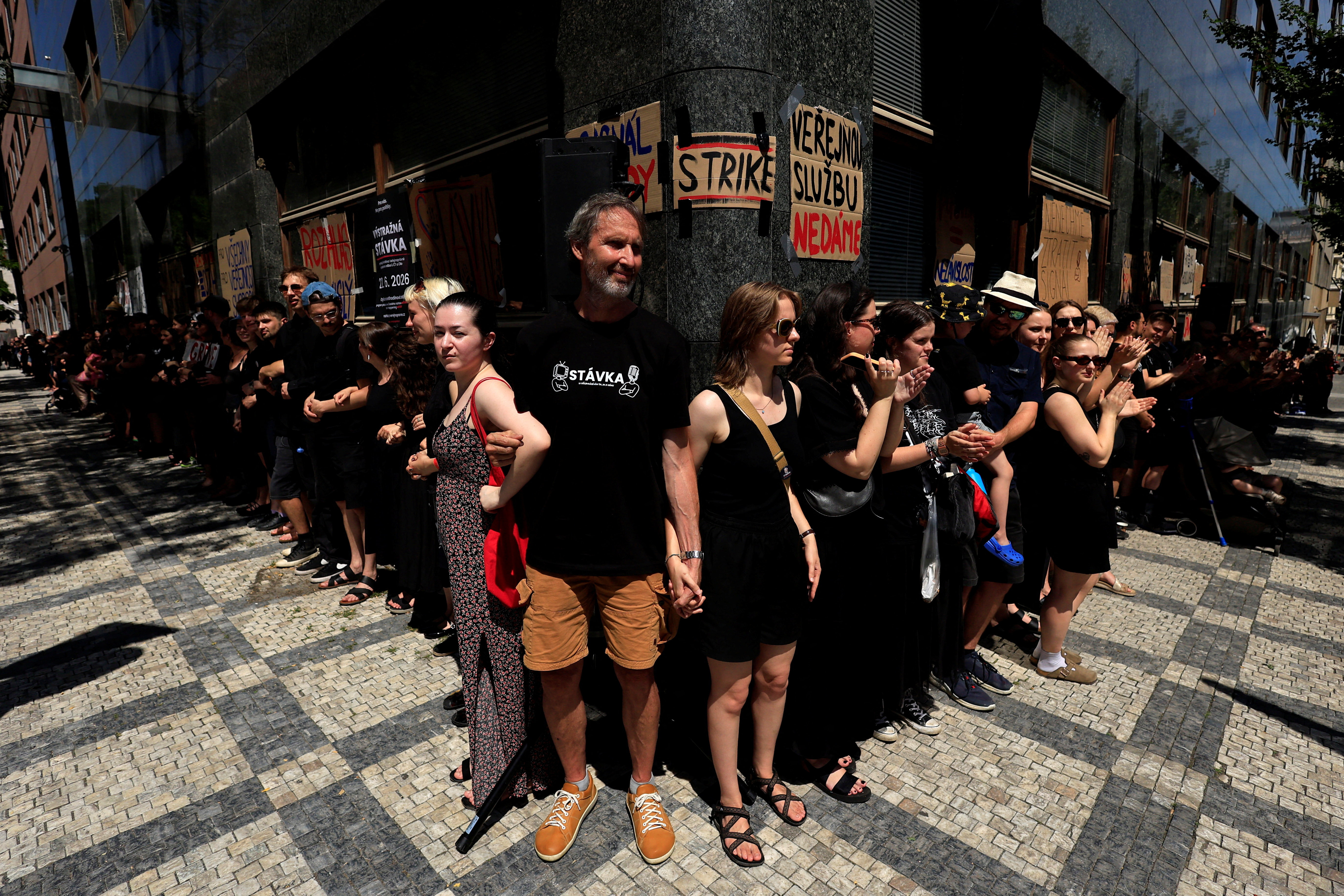 Employees of Czech Radio form a human chain during a warning strike in protest of the government's planned overhaul of public media funding, in Prague, Czech Republic, June 22, 2026. REUTERS/David W Cerny