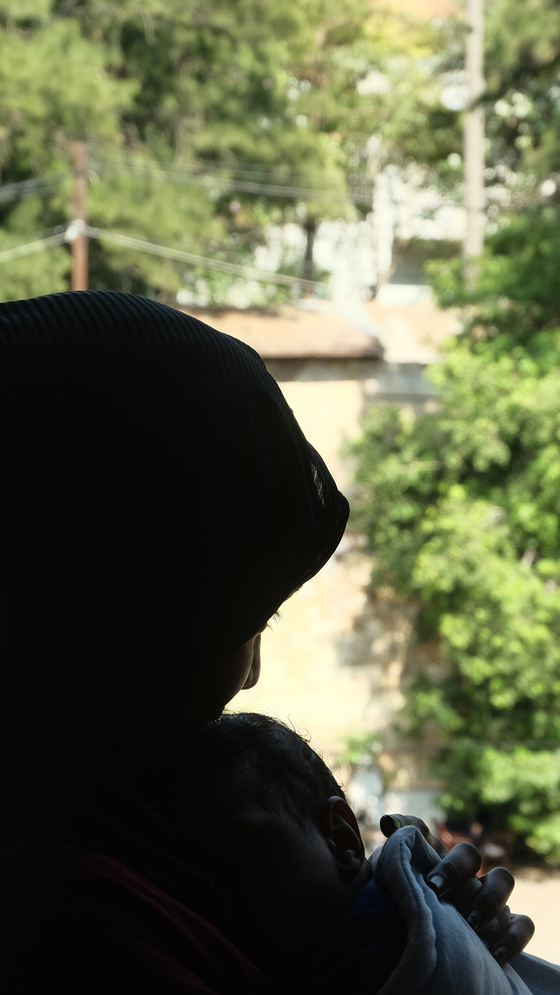 Rufaida, Mohammad and their son Ahmad are pictured in silhouette to conceal their identities over concerns for the safety of family members.
