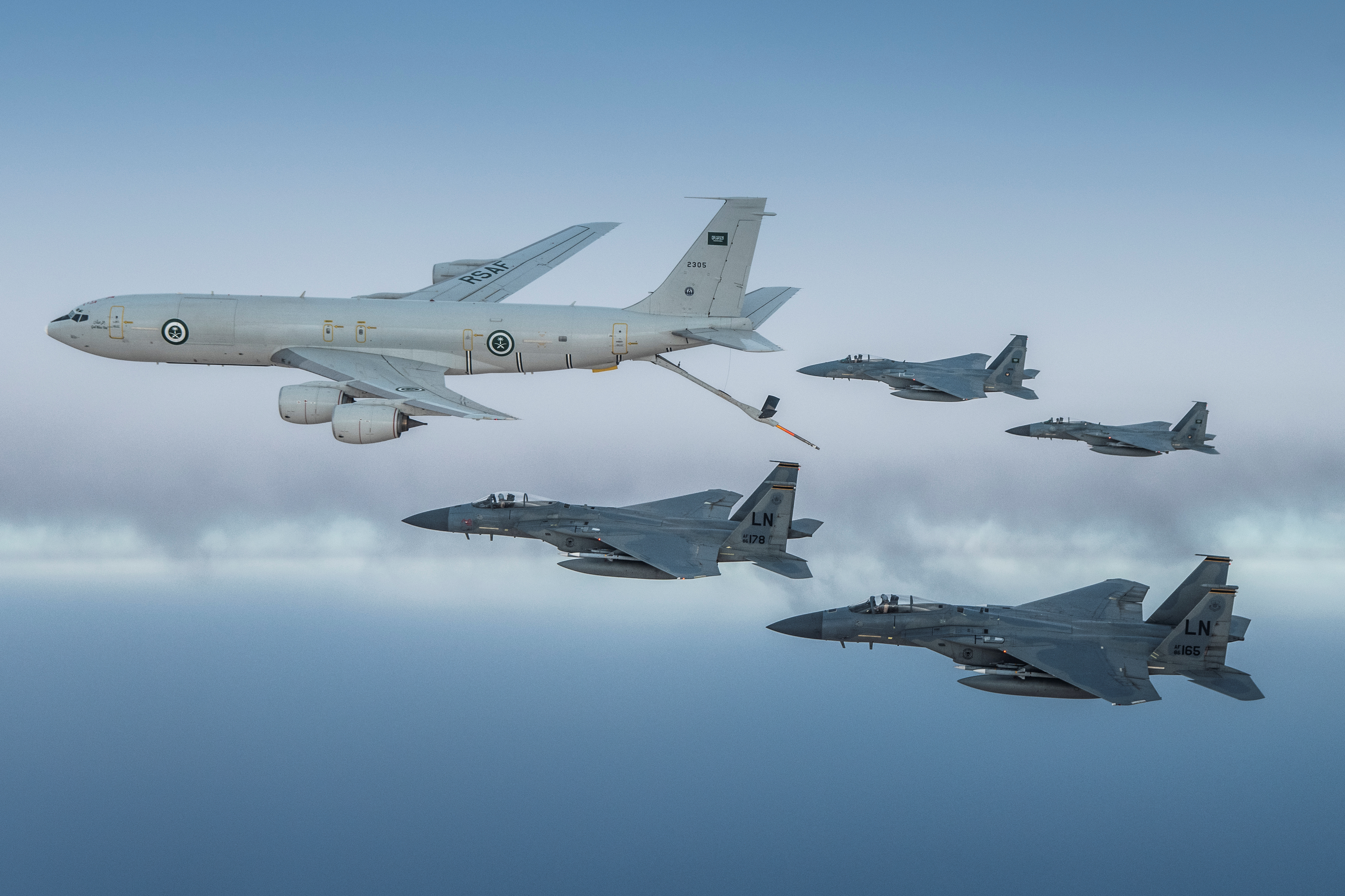 A Royal Saudi Air Force K-3 Tanker and Royal Saudi Air Force F-15C Eagles fly in formation with U.S. in an undisclosed location, June 2, 2019. Picture taken June 2, 2019. U.S. Navy/Handout via REUTERS ATTENTION EDITORS- THIS IMAGE HAS BEEN SUPPLIED BY A THIRD PARTY.