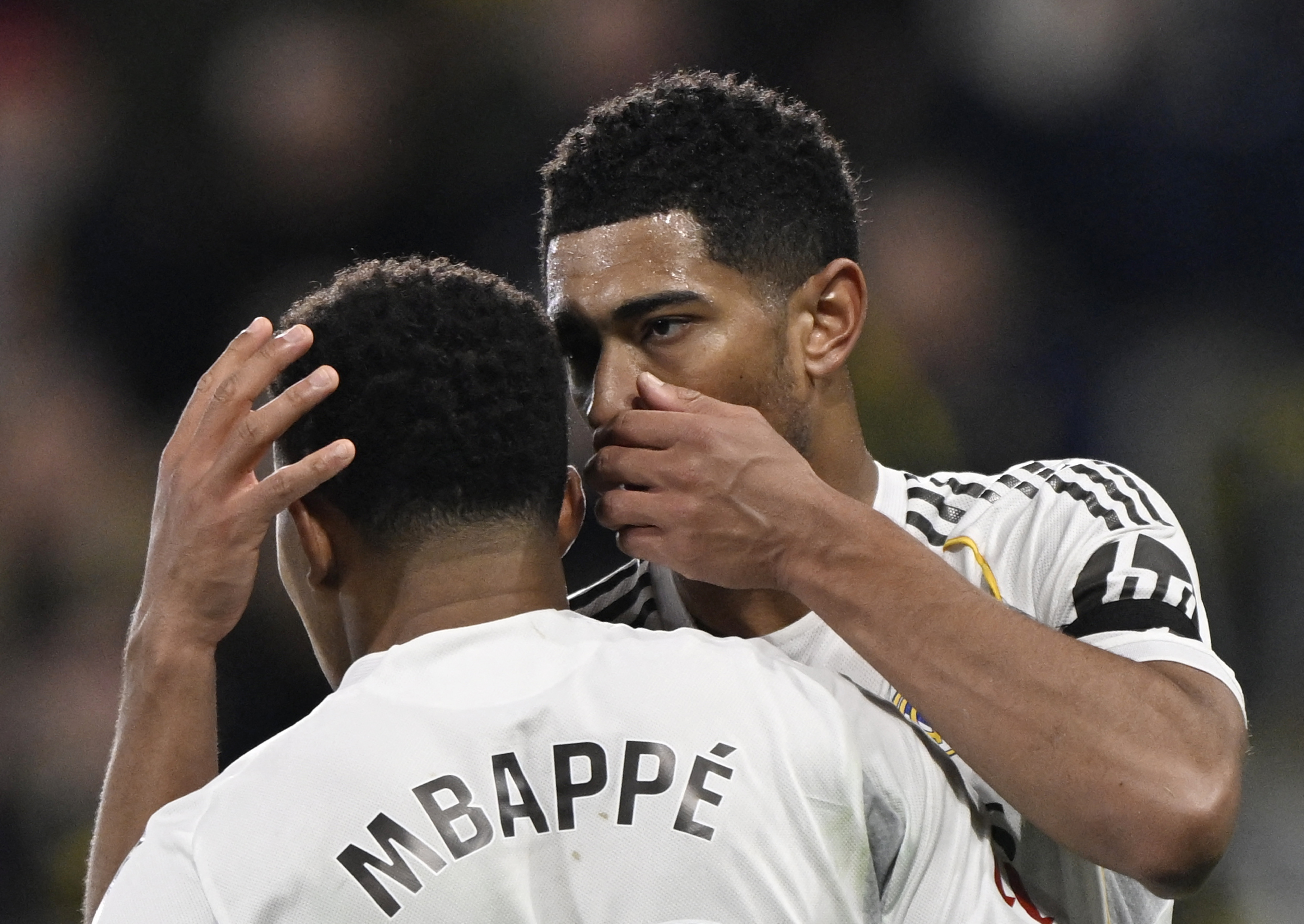 Real Madrid's Kylian Mbappe talks with Jude Bellingham before taking a penalty