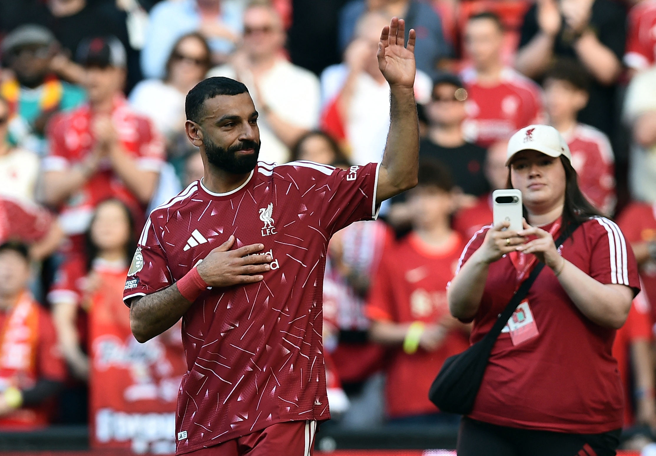 Liverpool's Mohamed Salah salutes the fans after playing his last match for the club