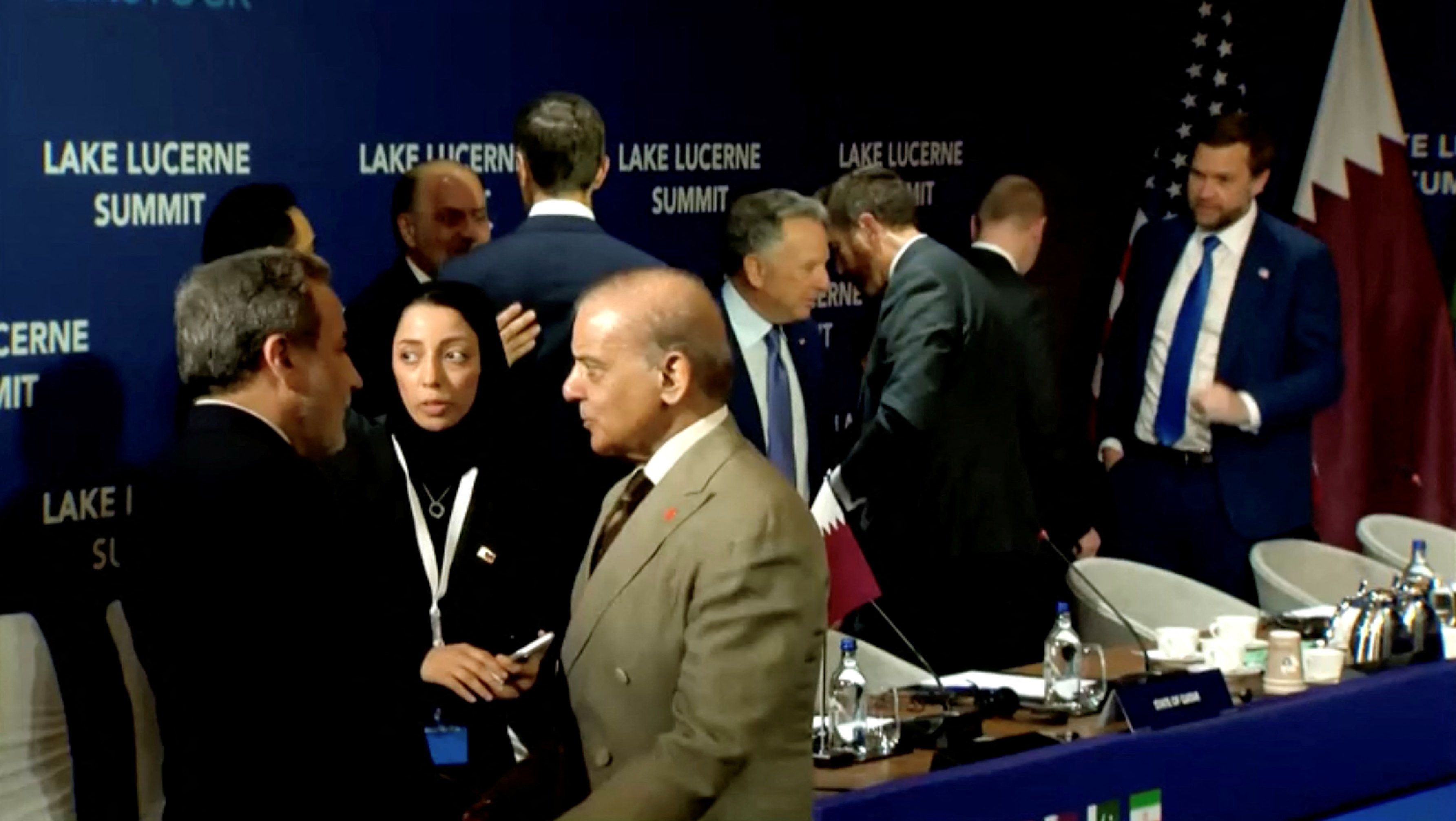 Pakistan's Prime Minister Shehbaz Sharif welcomes Iran's Foreign Minister Abbas Araghchi, as US Vice President JD Vance, President Donald Trump's son-in-law Jared Kushner and Trump's Special Envoy Steve Witkoff stand in the background.