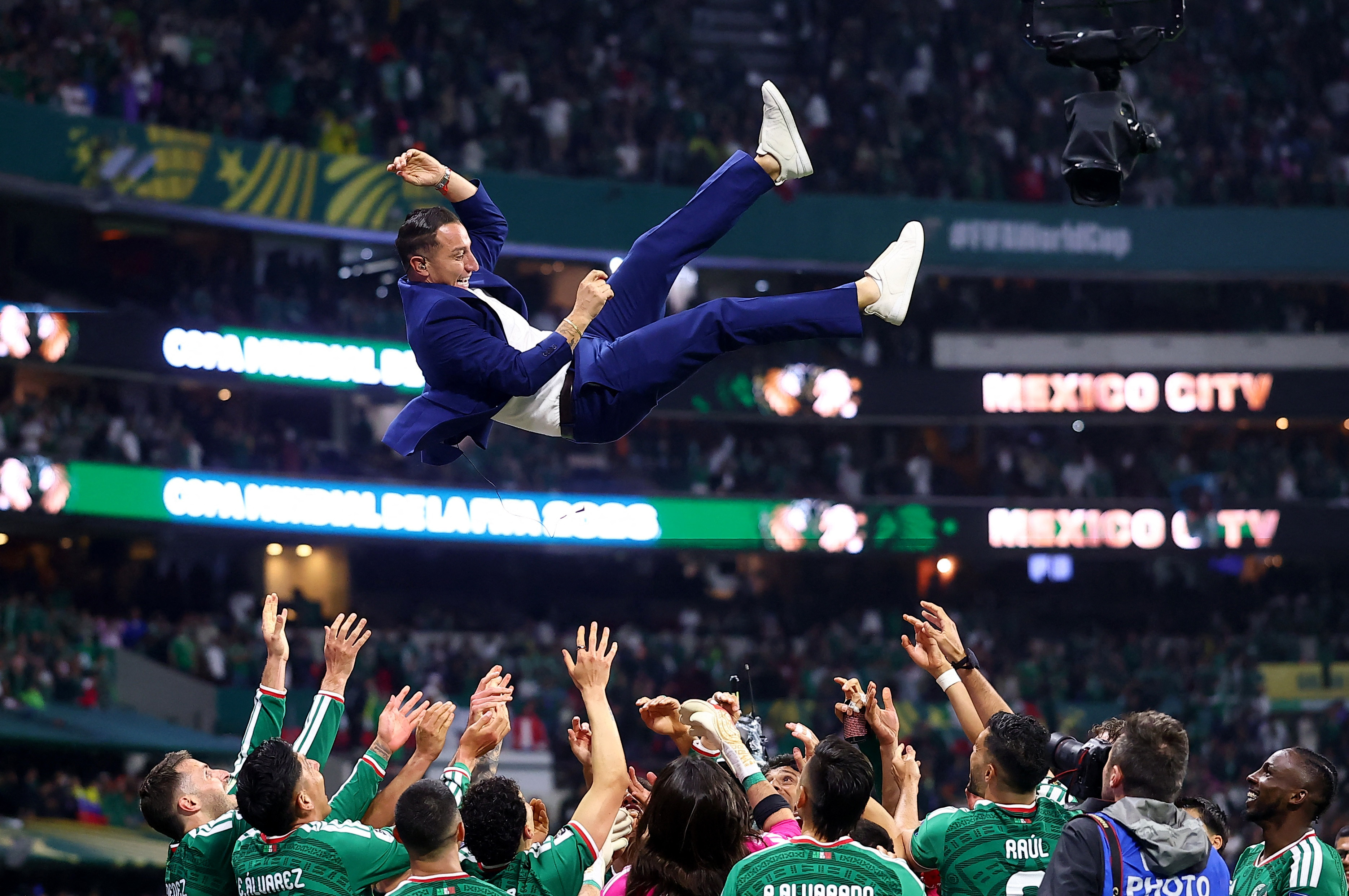 Soccer Football - FIFA World Cup 2026 - Round of 32 - Mexico v Ecuador - Estadio Azteca, Mexico City, Mexico - June 30, 2026 Former Mexico player Andres Guardado is thrown in the air in celebration by the players after the match as Mexico qualify for the round of 16 stage of the World Cup REUTERS/Eloisa Sanchez