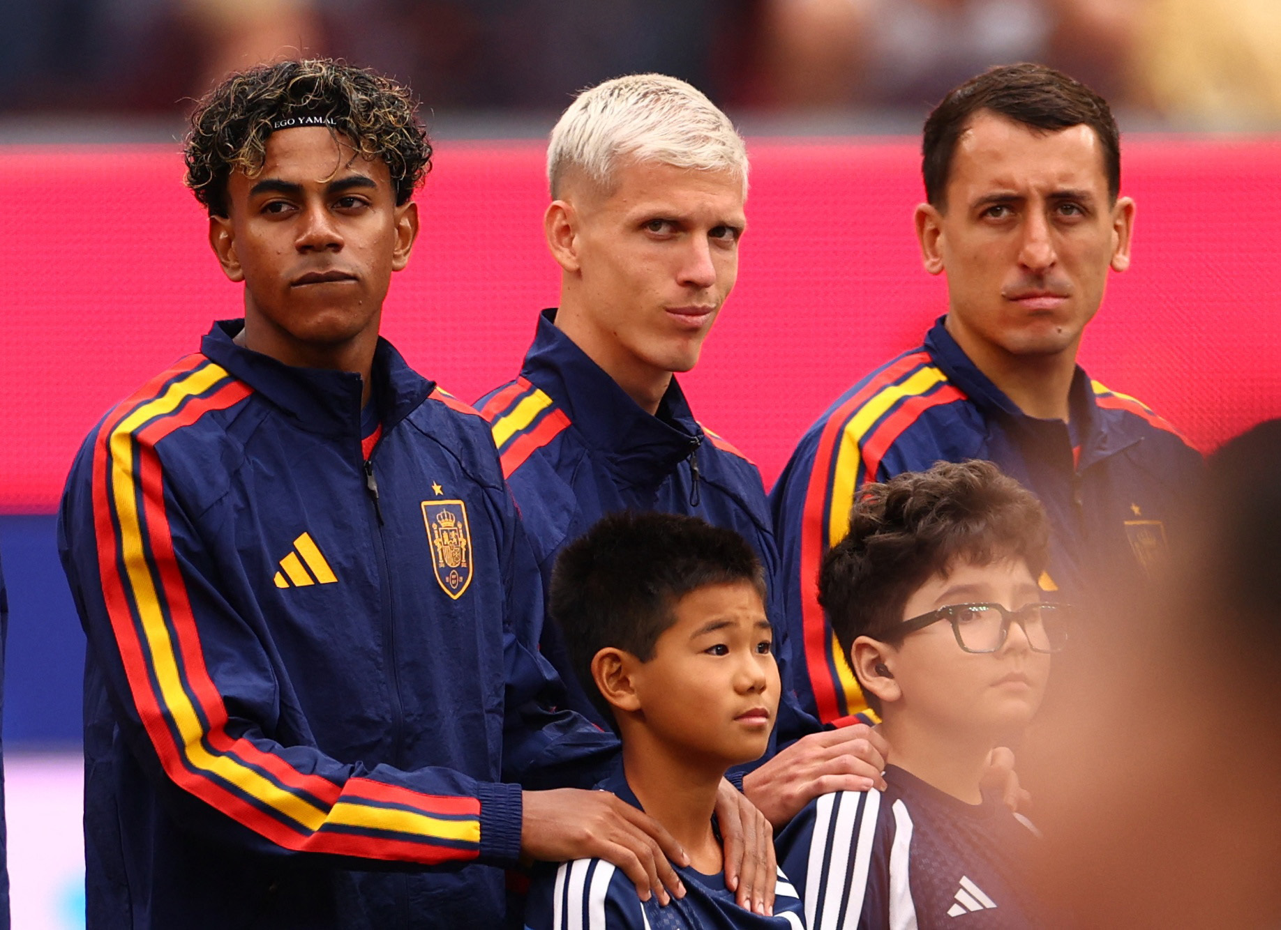 Spain’s Lamine Yamal lines up with Dani Olmo and Mikel Oyarzabal before a World Cup match