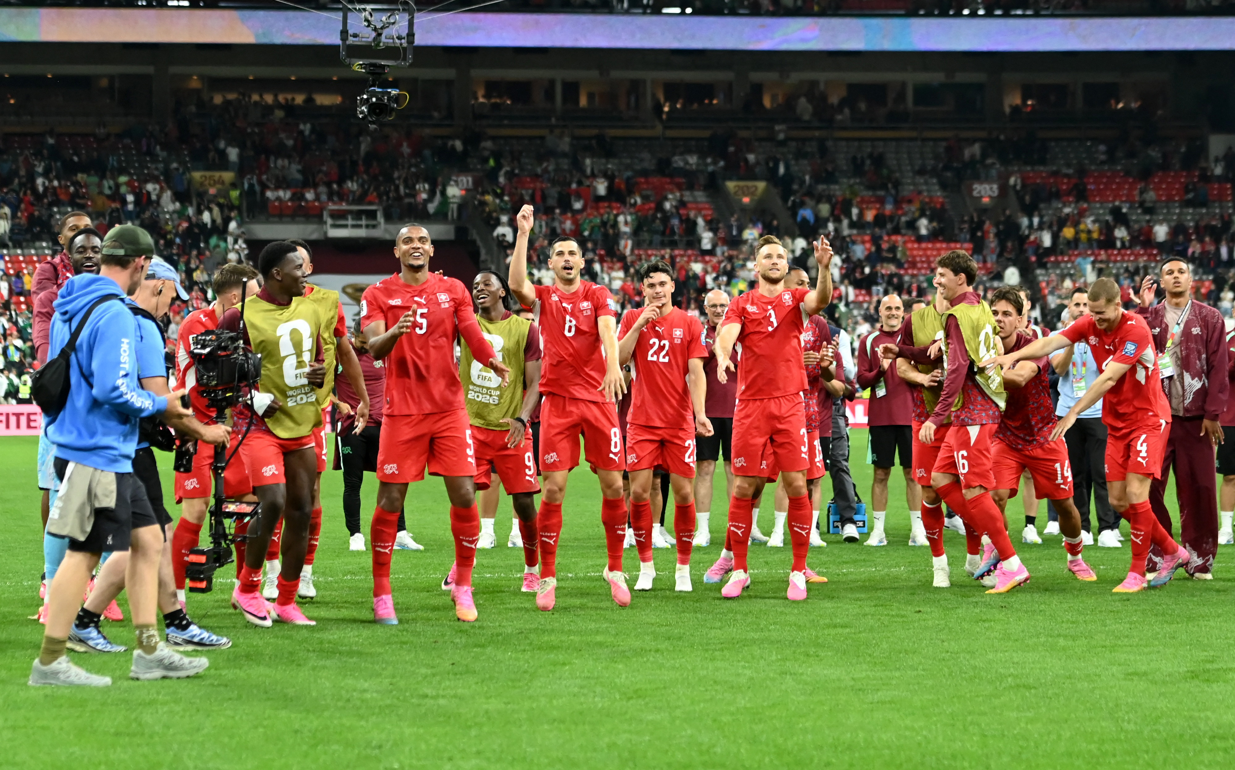 Switzerland players celebrate after the match.