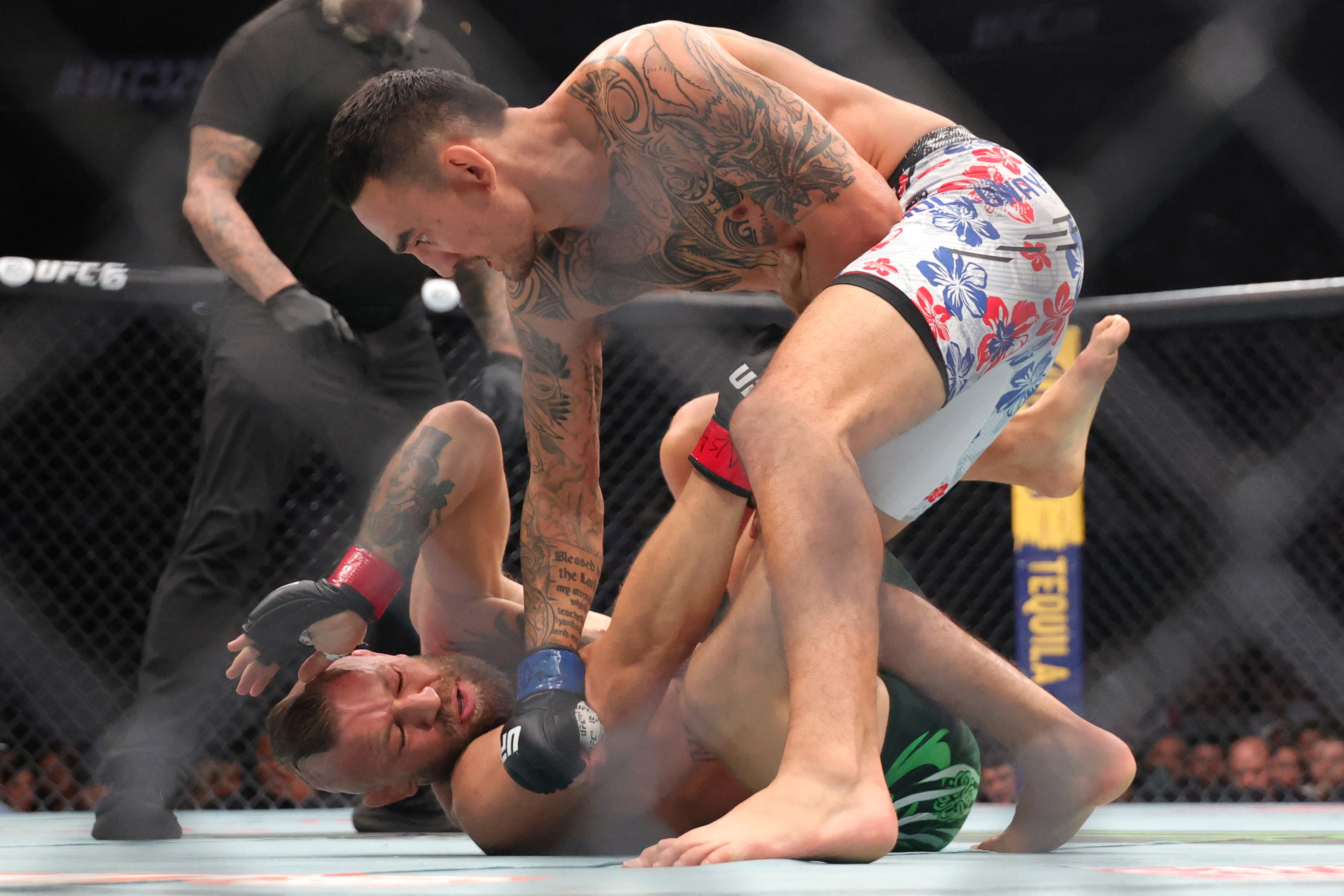 McGregor, with red gloves, was injured in the first round against Max Holloway in their welterweight bout at UFC 329 at T-Mobile Arena, Las Vegas, US, on July 11, 2026