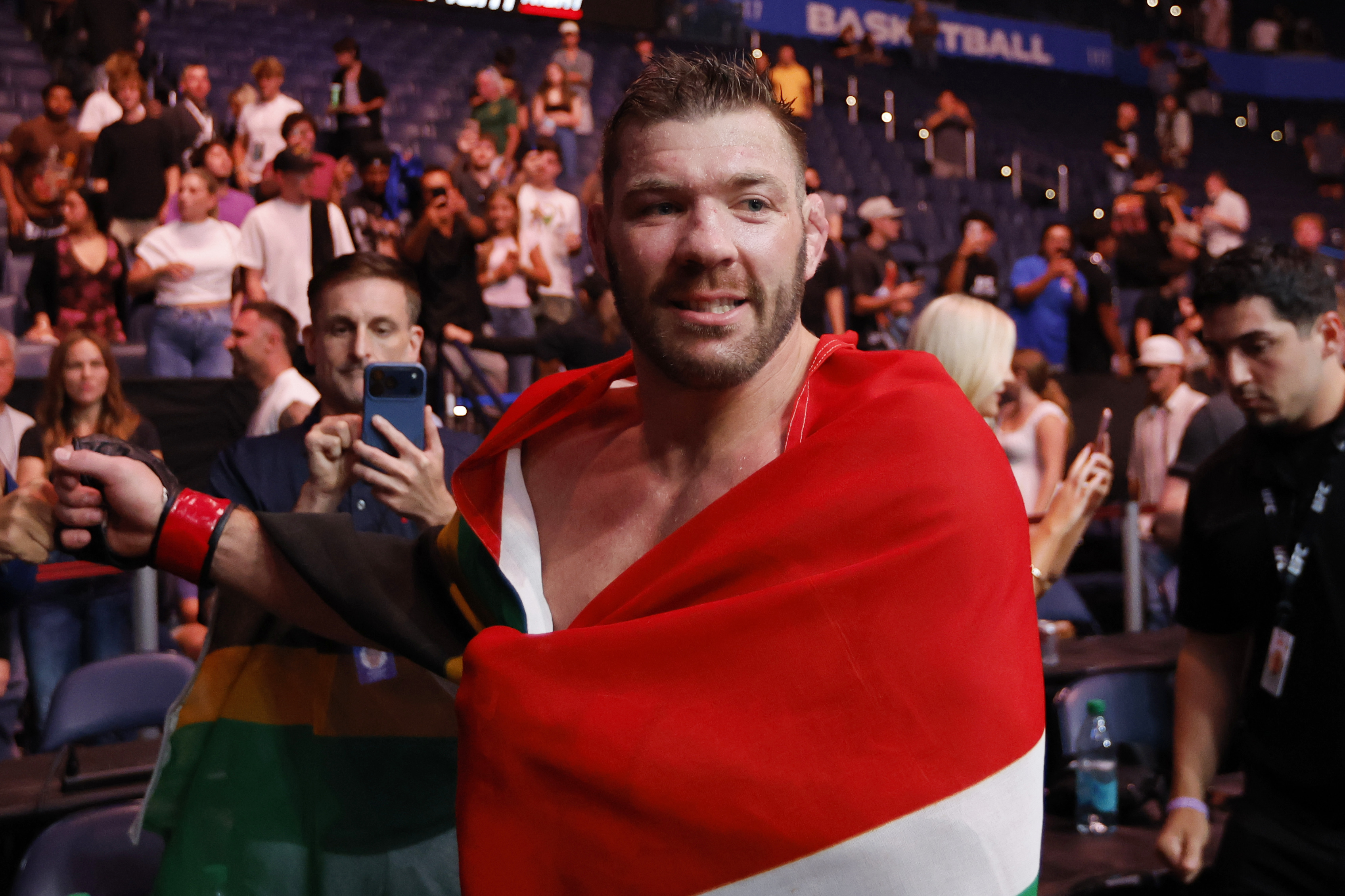 Jul 18, 2026; Oklahoma City, Oklahoma, USA; Dricus Du Plessis (red gloves) celebrates defeating Kamaru Usman (blue gloves) during UFC Fight Night at Paycom Center. Mandatory Credit: Alonzo Adams-Imagn Images