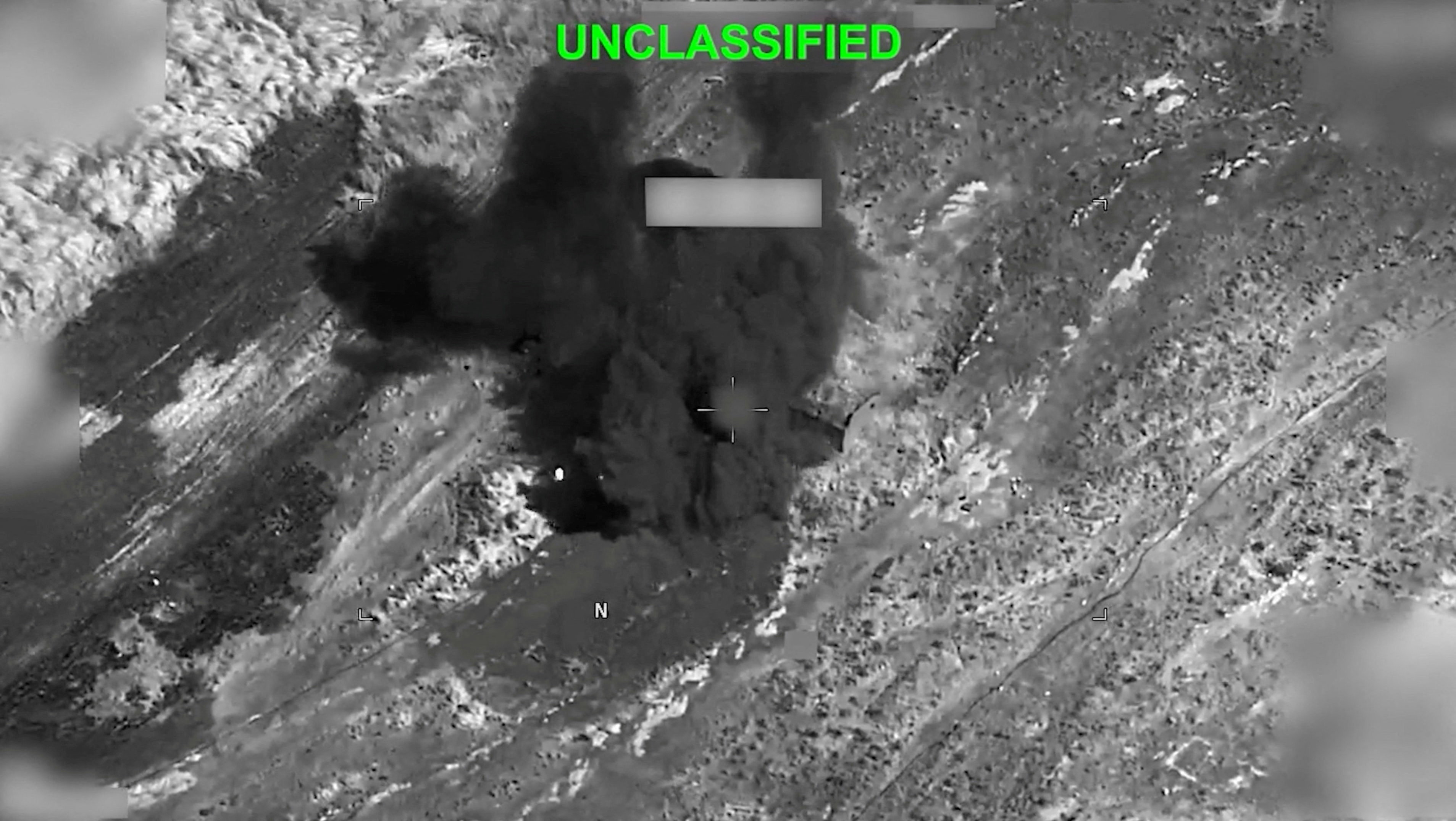 Smoke rises from an explosion at an unknown location,
