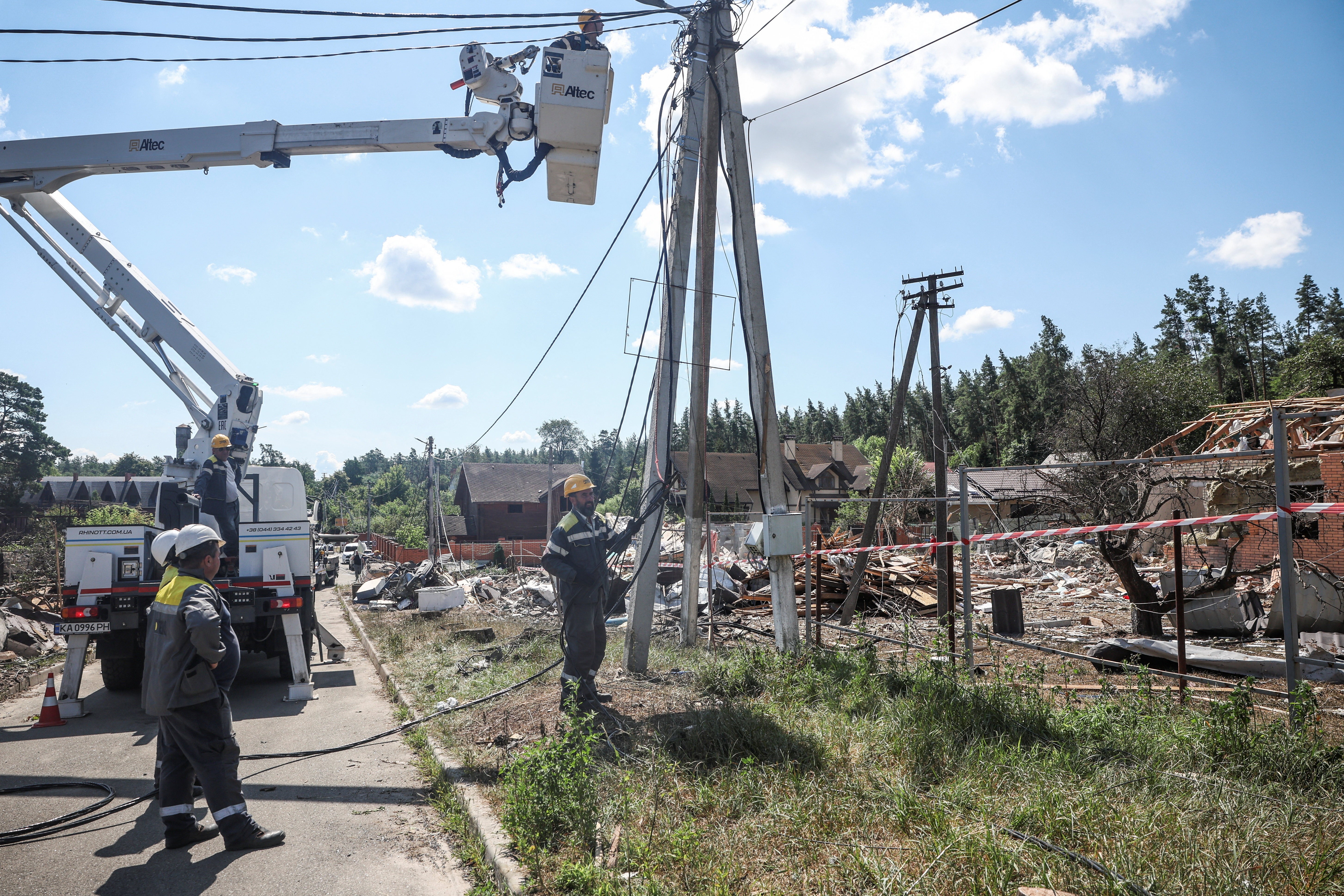 Employees of DTEK energy company work to restore power supply after a residential area was hit by a Russian missile strike in the Kyiv region, Ukraine on July 25, 2026.