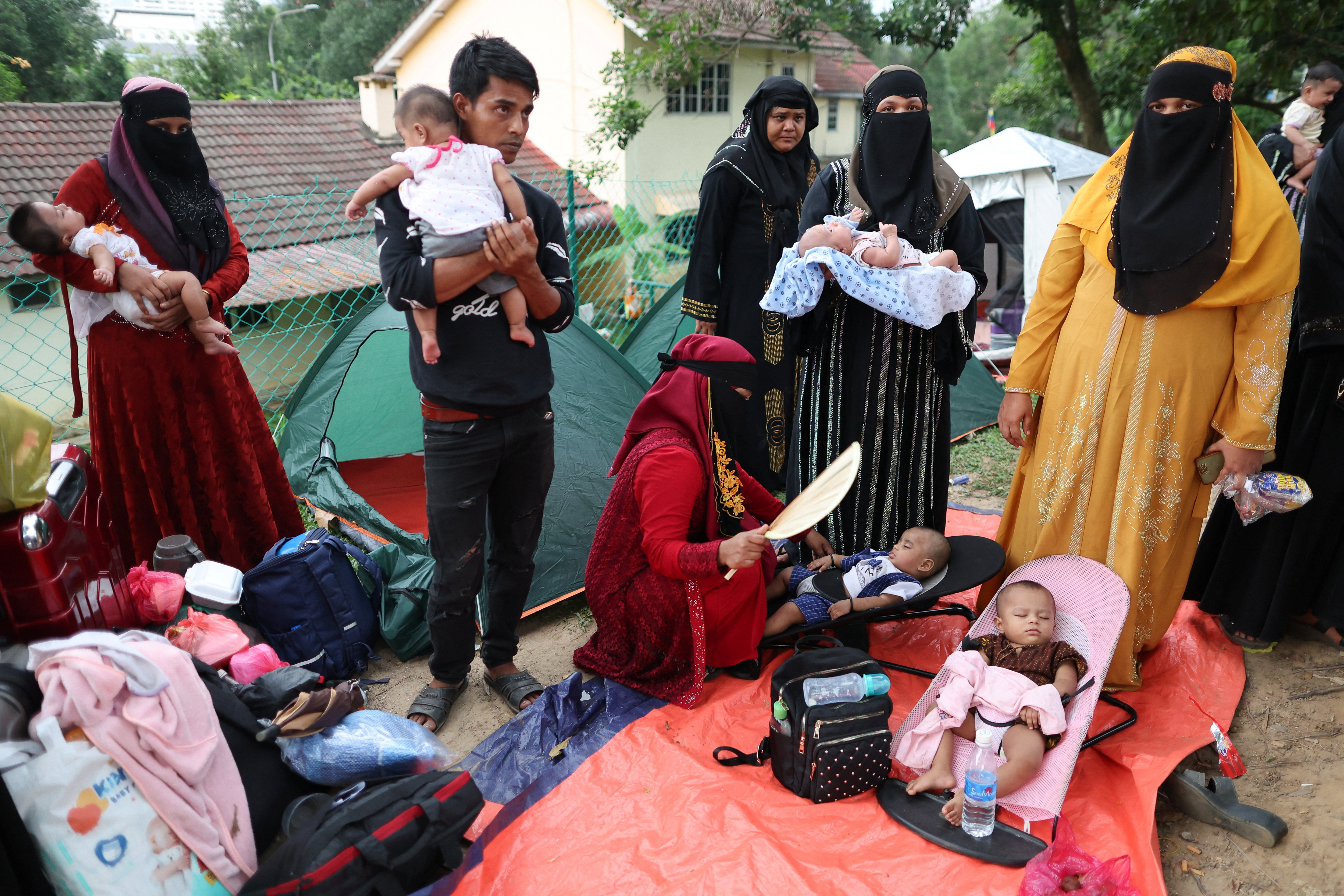 Rohingya refugees gather in front of the office of the UN Refugee Agency (UNHCR) after being evicted from their homes, at Kuala Lumpur Malaysia.REUTERS/Hasnoor Hussain
