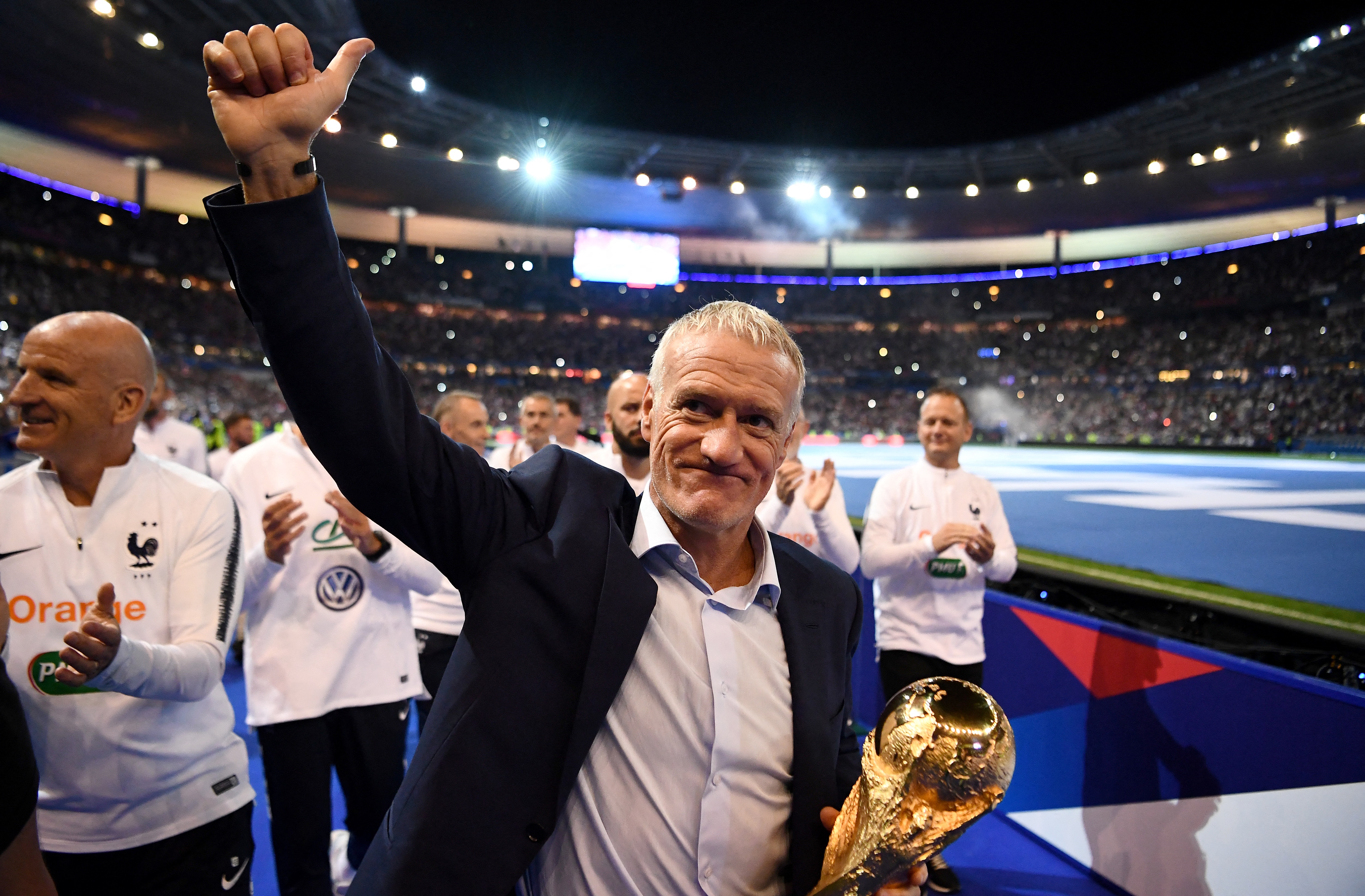 France's coach Didier Deschamps celebrates as they do a lap of honour during a ceremony to celebrate the victory of the 2018 World Cup at the end of the UEFA Nations League football match between France and Netherlands at the Stade de France stadium, in Saint-Denis, northern of Paris, on September 9, 2018. (Photo by FRANCK FIFE / AFP)