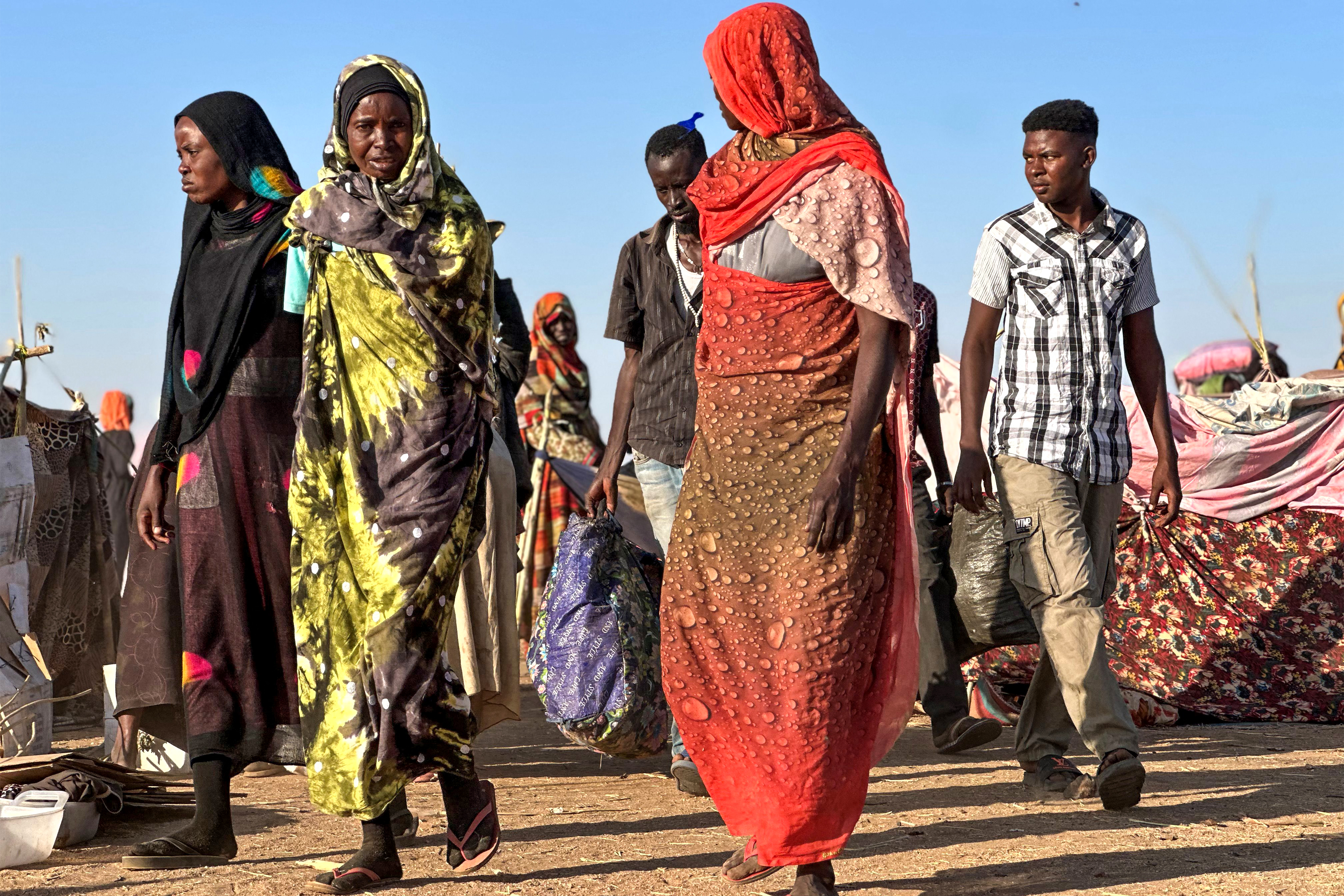 Displaced Sudanese who fled El-Fasher after the city fell to the Rapid Support Forces (RSF), arrive in the town of Tawila in war-torn Sudan's western Darfur region on October 28, 2025.