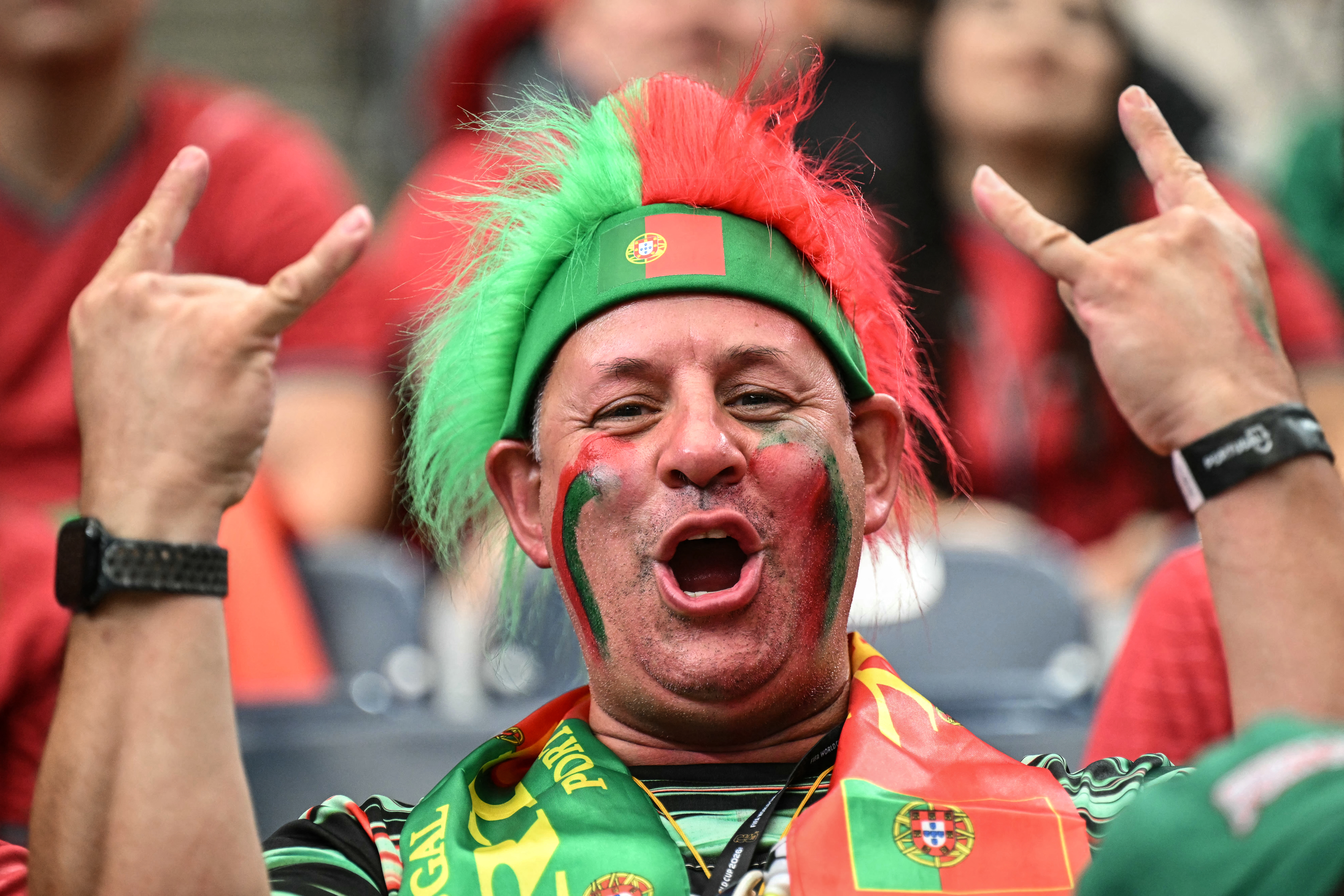 A Portugal supporter cheers prior to the 2026 World Cup Group K football match between Portugal and Uzbekistan at the Houston Stadium in Houston on June 23, 2026. (Photo by RONALDO SCHEMIDT / AFP)