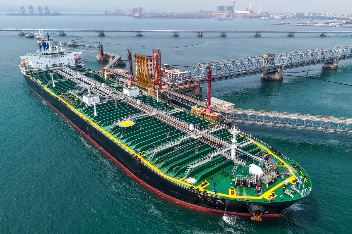 A tanker unloading imported crude oil at a terminal port in Qingdao, China, on June 25